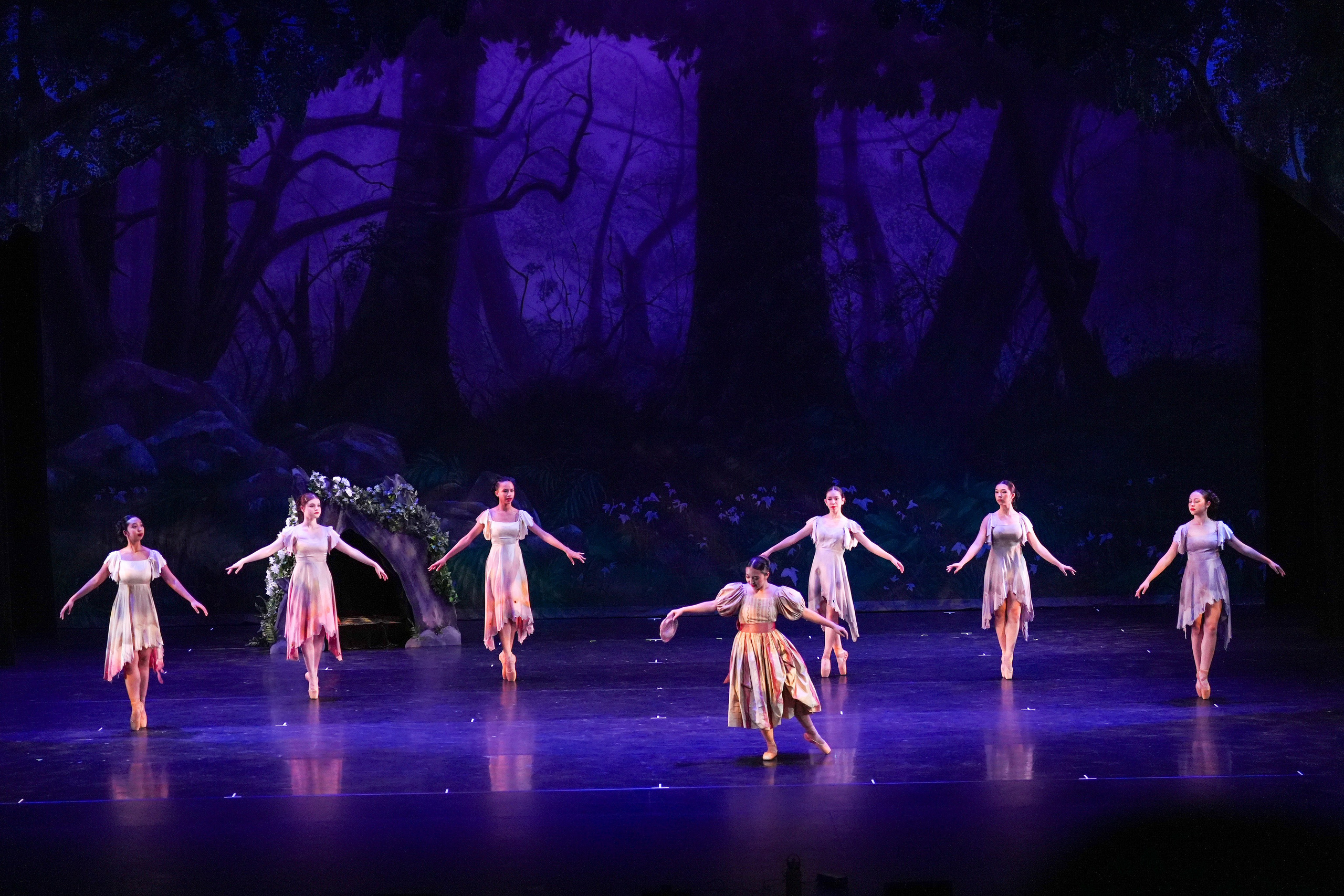 Helena looking sad with fairies in the background during A Midsummer Night’s Dream by Santa Clarita Ballet Company.