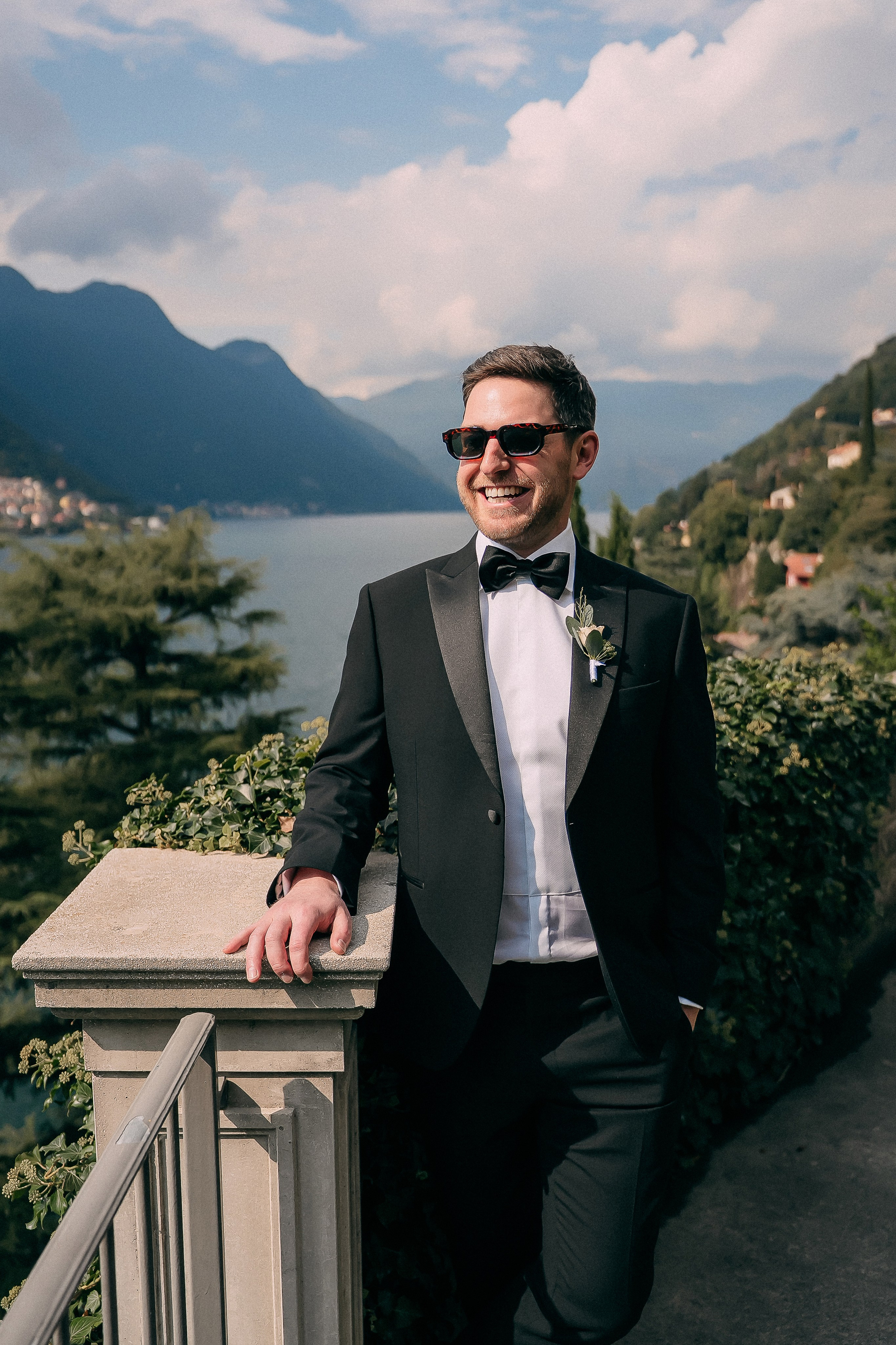 Groom adjusting his cufflinks before the Lake Como wedding at Villa Lario, Italy