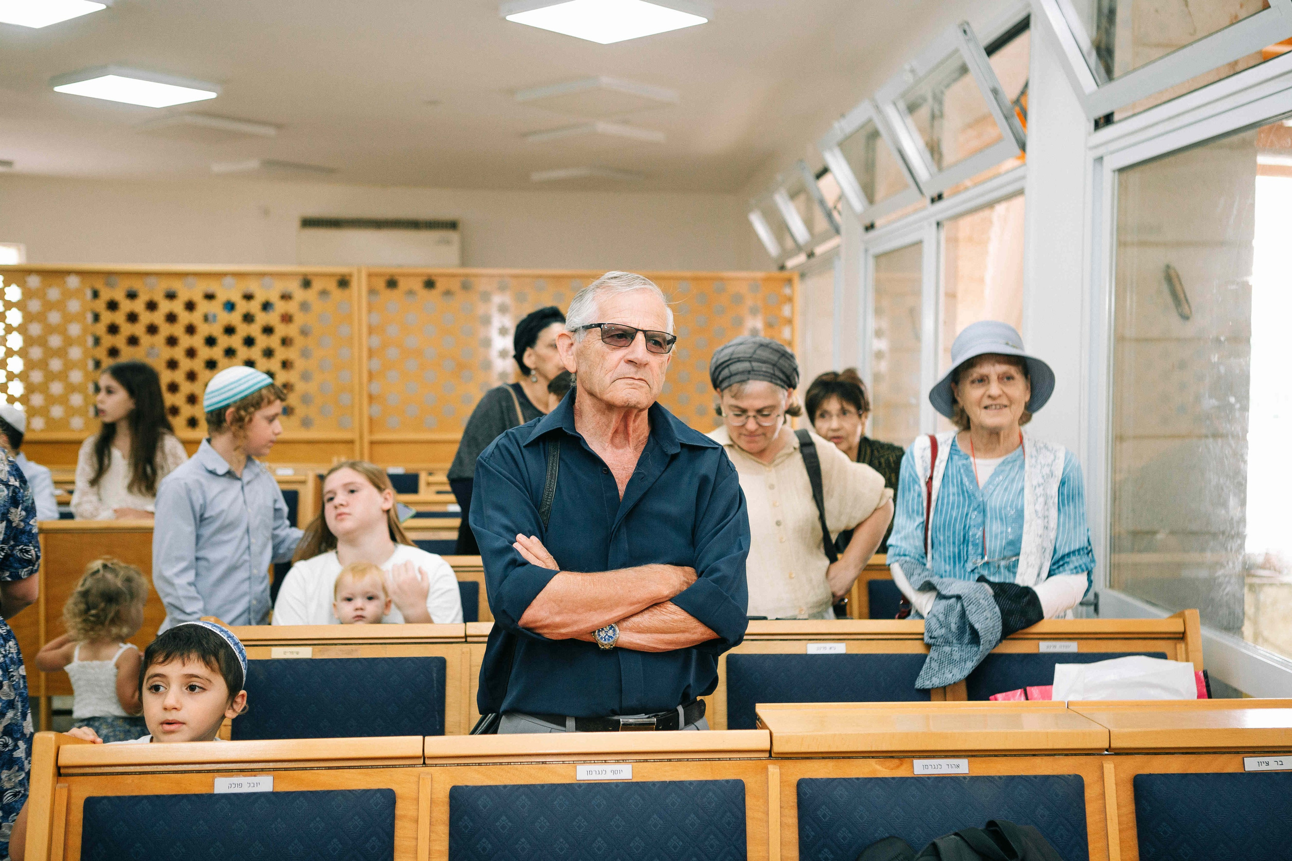 BRITH MILA IN THE SMALL SYNAGOGUE. PHOTOGRAPHER IN ISRAEL