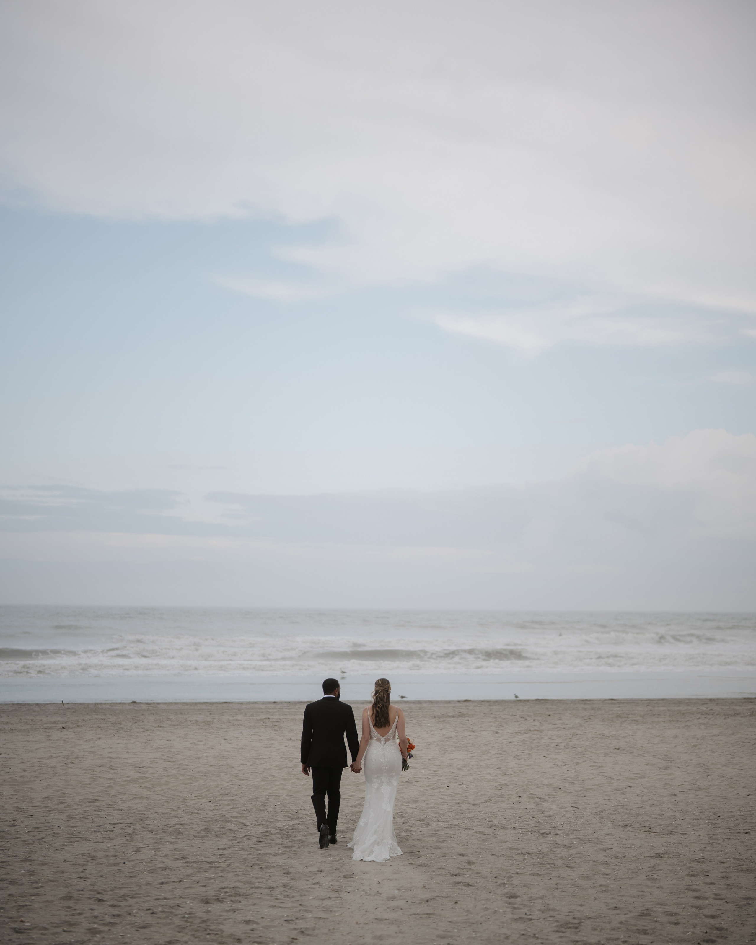 Wedding walk on the beach. Portrait and wedding photographer in New York