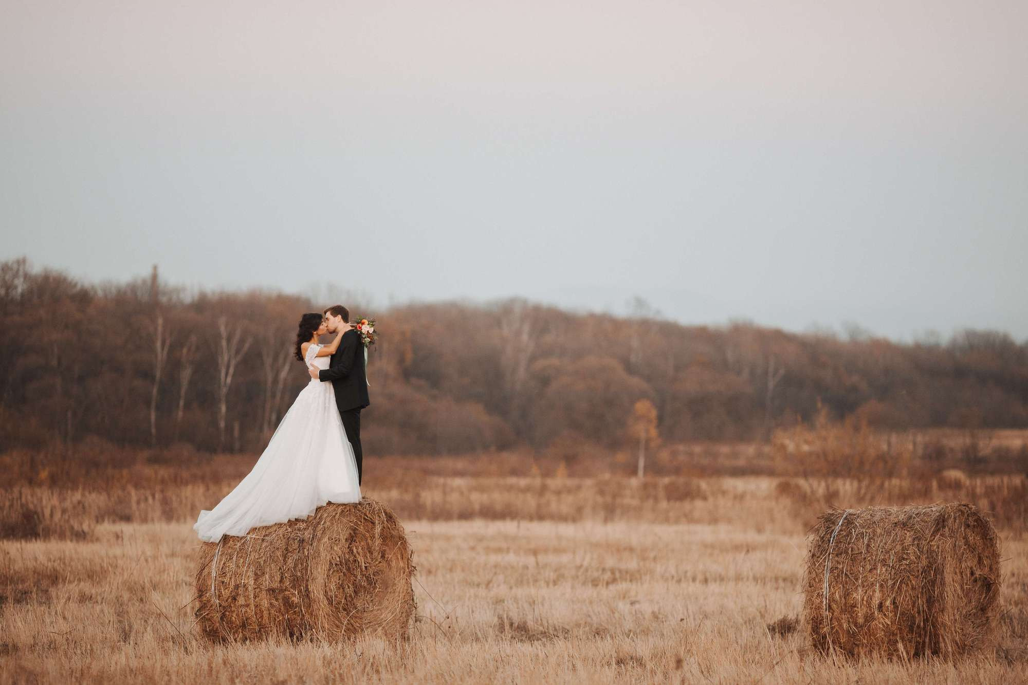 Elopement in Stacks of Hay. Wedding Photography & Videography Team in California, Los Angeles, San Francisco, San Diego and Travel