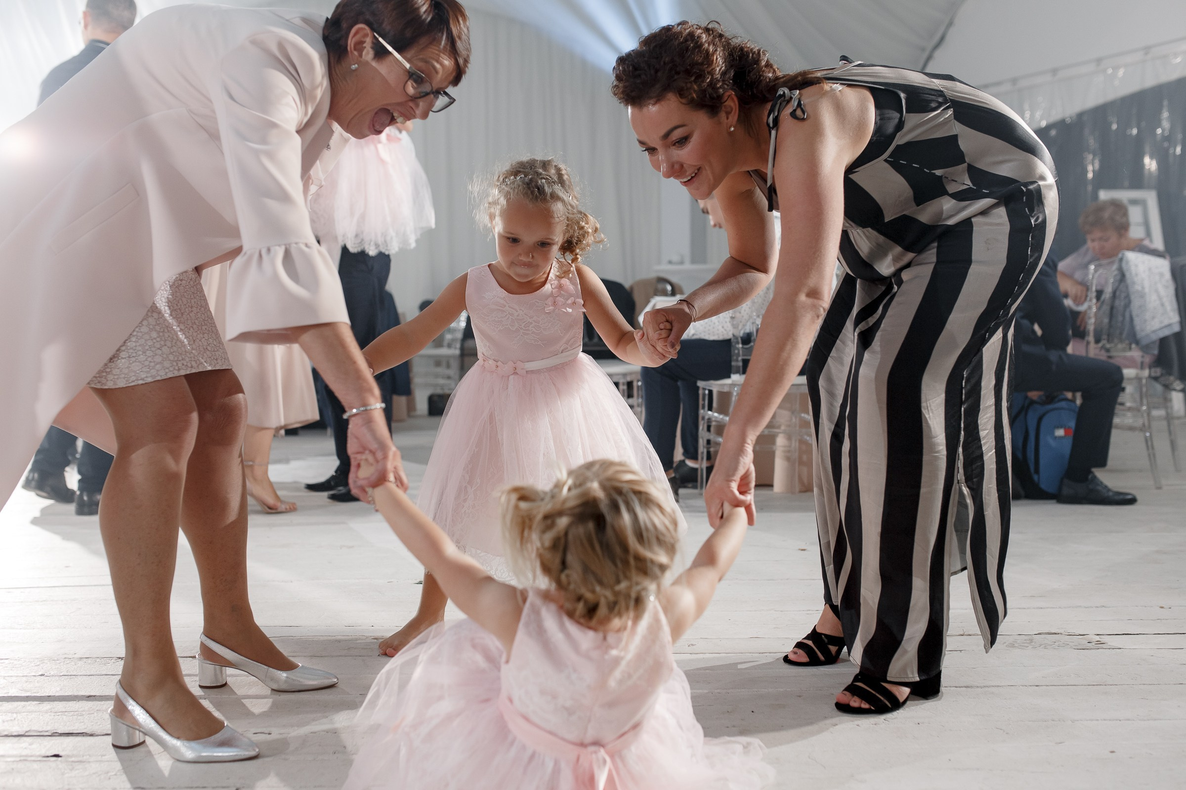 Guests dancing energetically, by Cornwall wedding photographer.