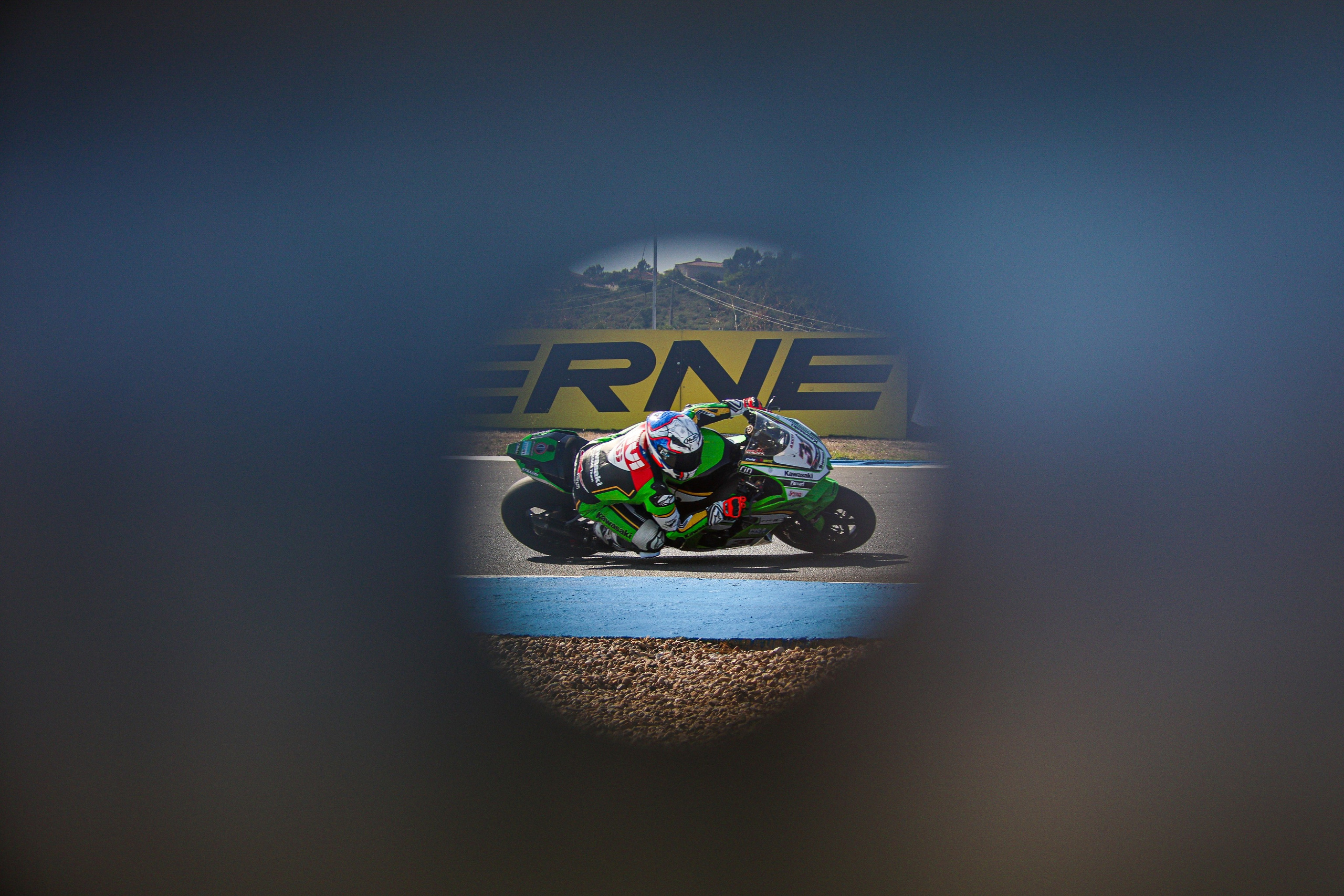 Garrett Gerloff through a whole in the rail Estoril circuit Portugal WorldSBK 