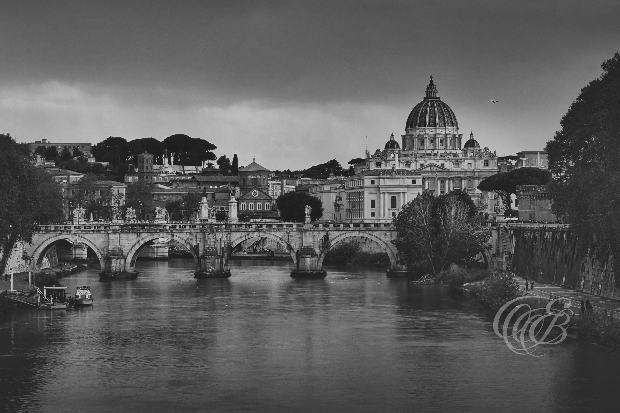 Rome Italy - Ponte Sant'Angelo with a view of St. Peter's Basilica - Eduardo Bartoli Fine Art Photography - Black and white matte fine art photograph of Ponte Sant'Angelo with St. Peter's Basilica in Rome, Italy – photography by Eduardo Bartoli.