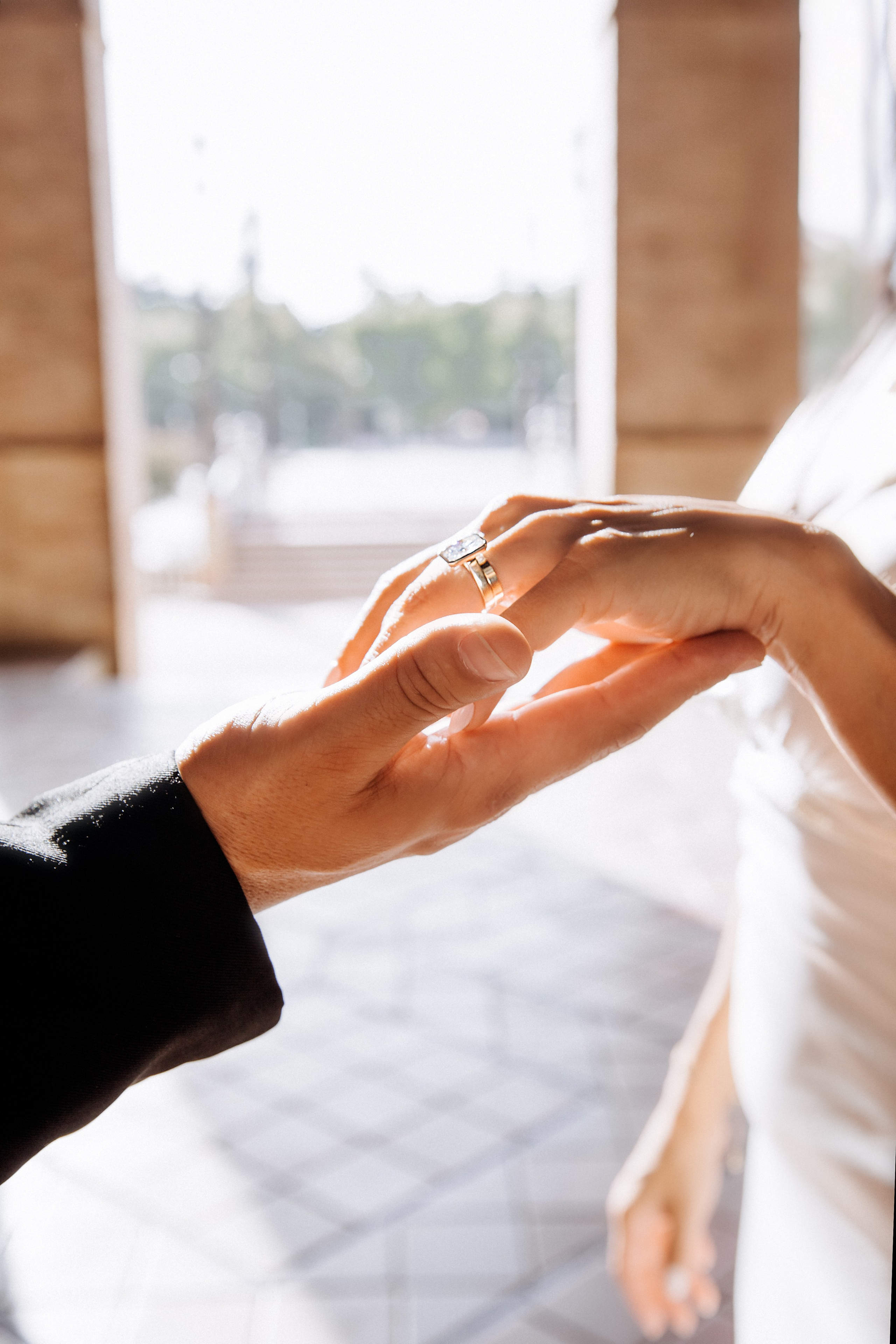 Close-up of a groom gently placing a wedding ring on the bride’s finger during an intimate ceremony in Valencia, Spain. A timeless and emotional moment captured for couples seeking elegant and meaningful wedding photography in Valencia and across Spain.