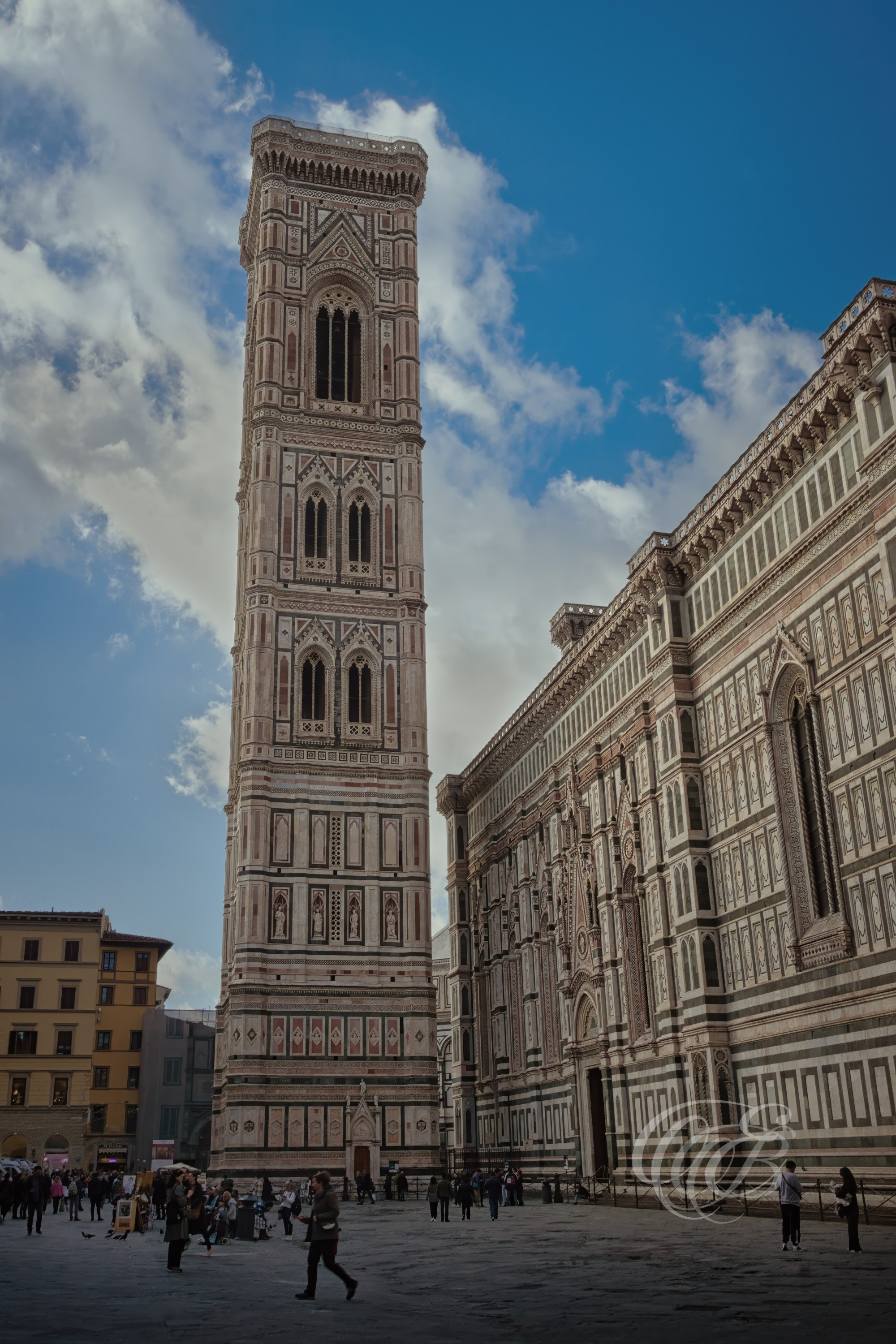 Florence, Italy — Giotto’s Bell Tower at Sunset — View of Giotto’s Bell Tower, part of the Florence Cathedral complex, photographed during the evening hours — Photography by Eduardo Bartoli.