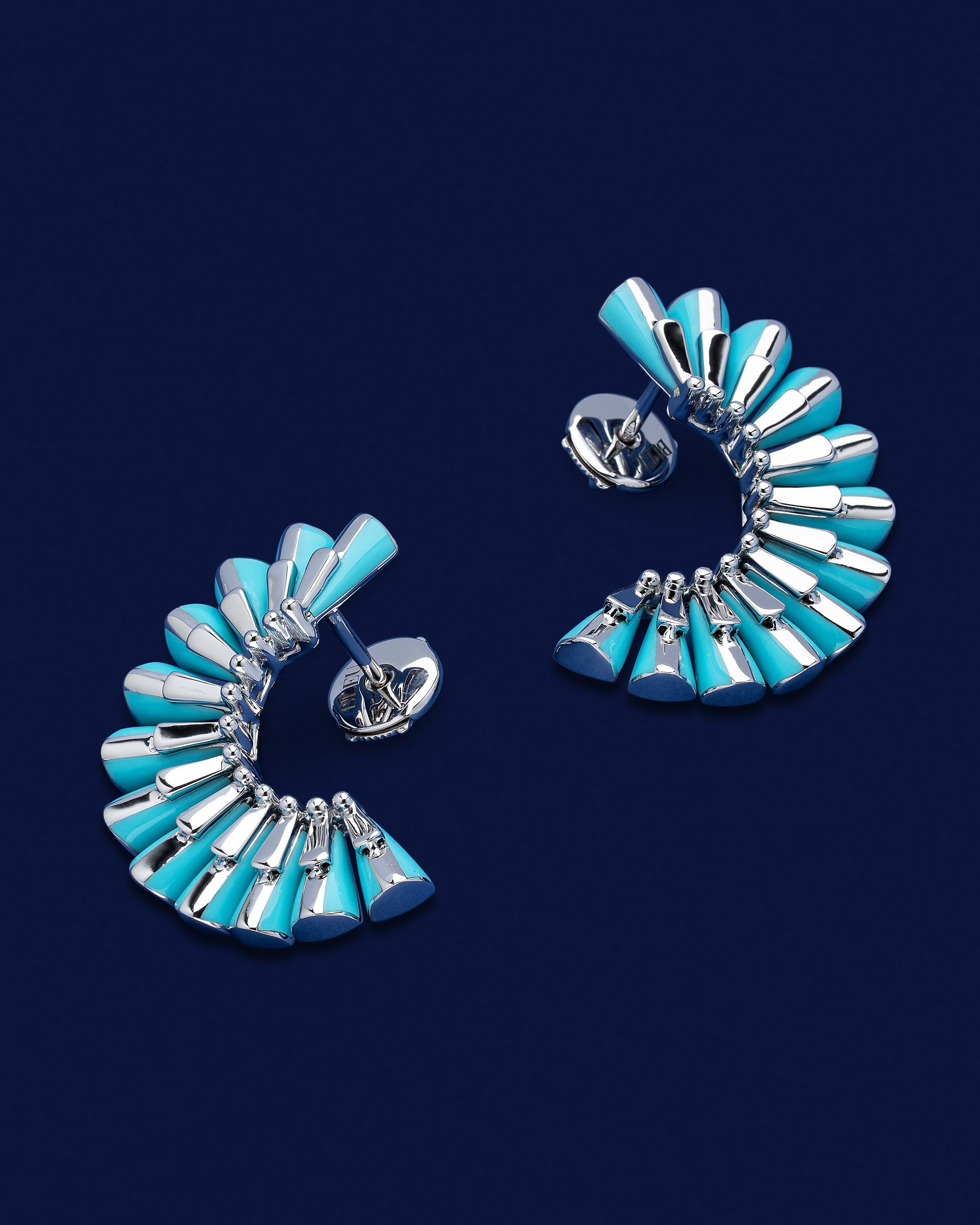 Turquoise earrings in studio product photography setup