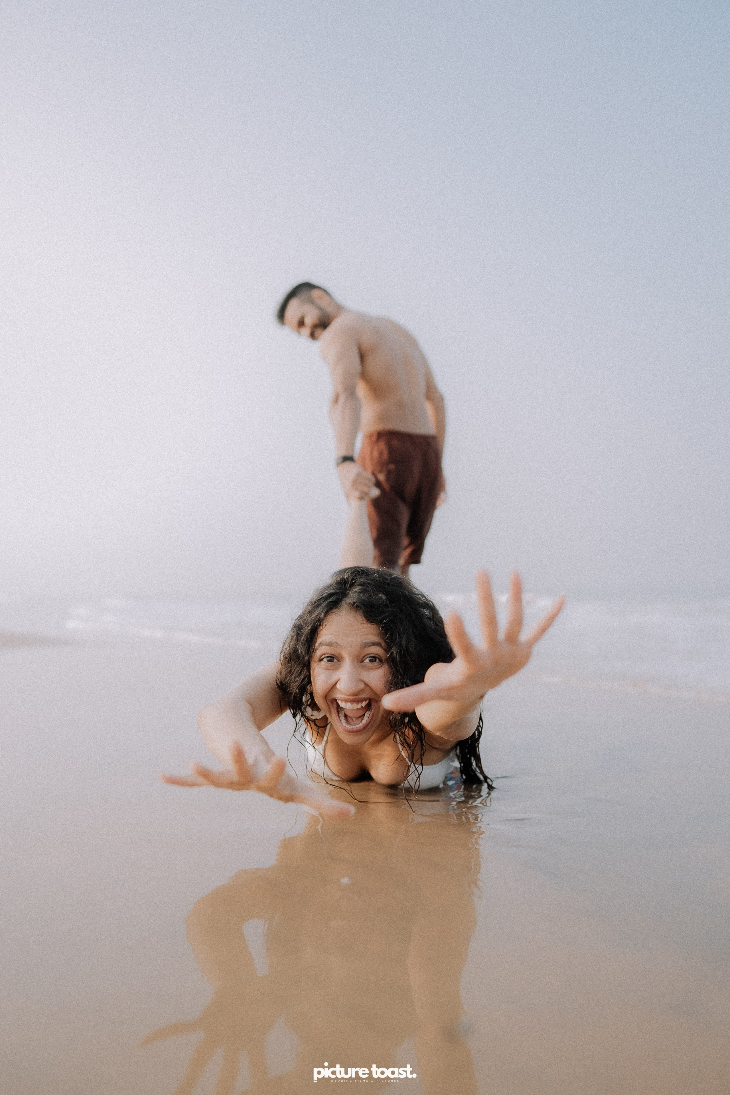 Love In The Beach. Fine art Wedding Photographers in India & Canada