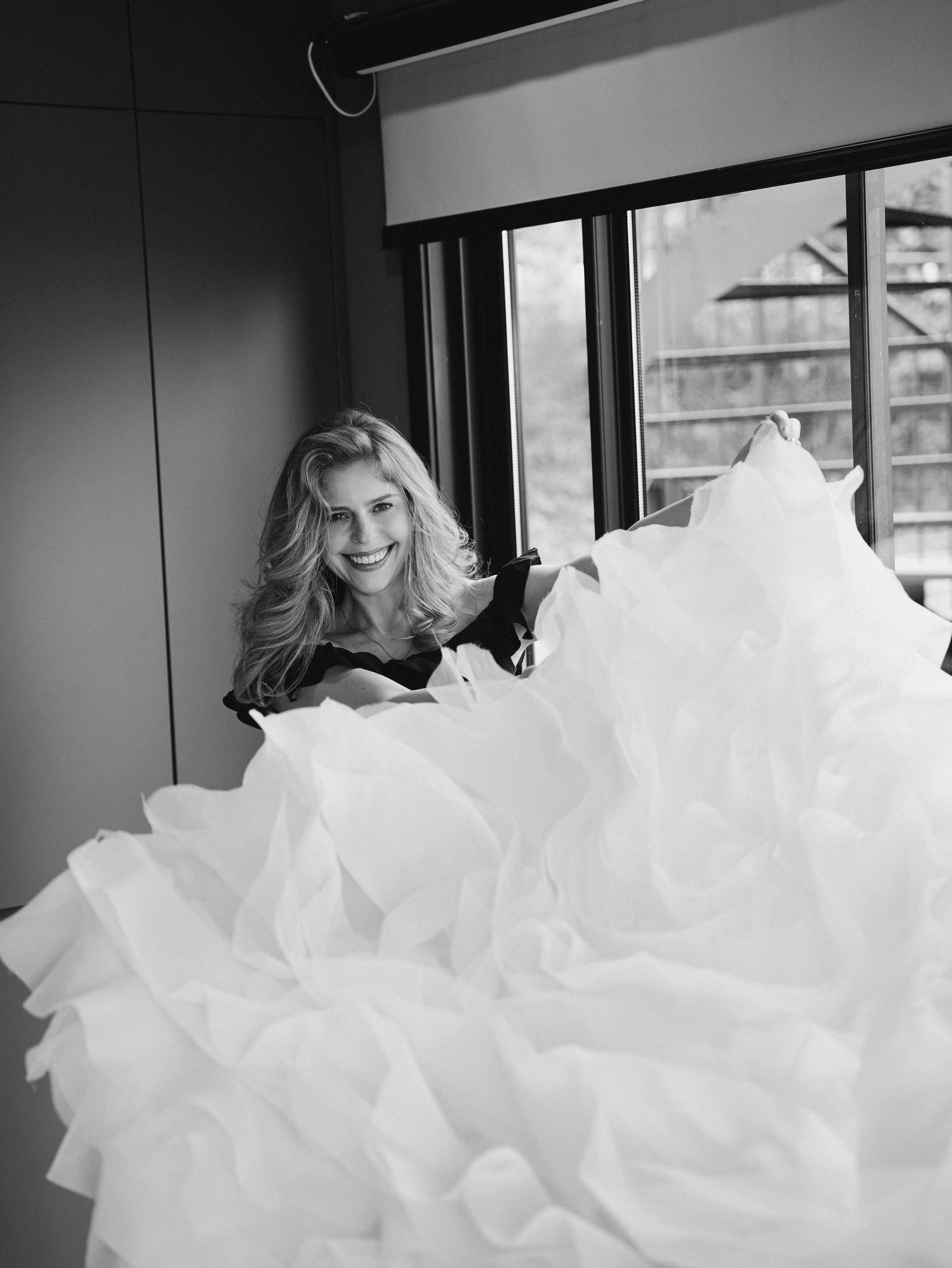 Bride with dress near window morning preparation