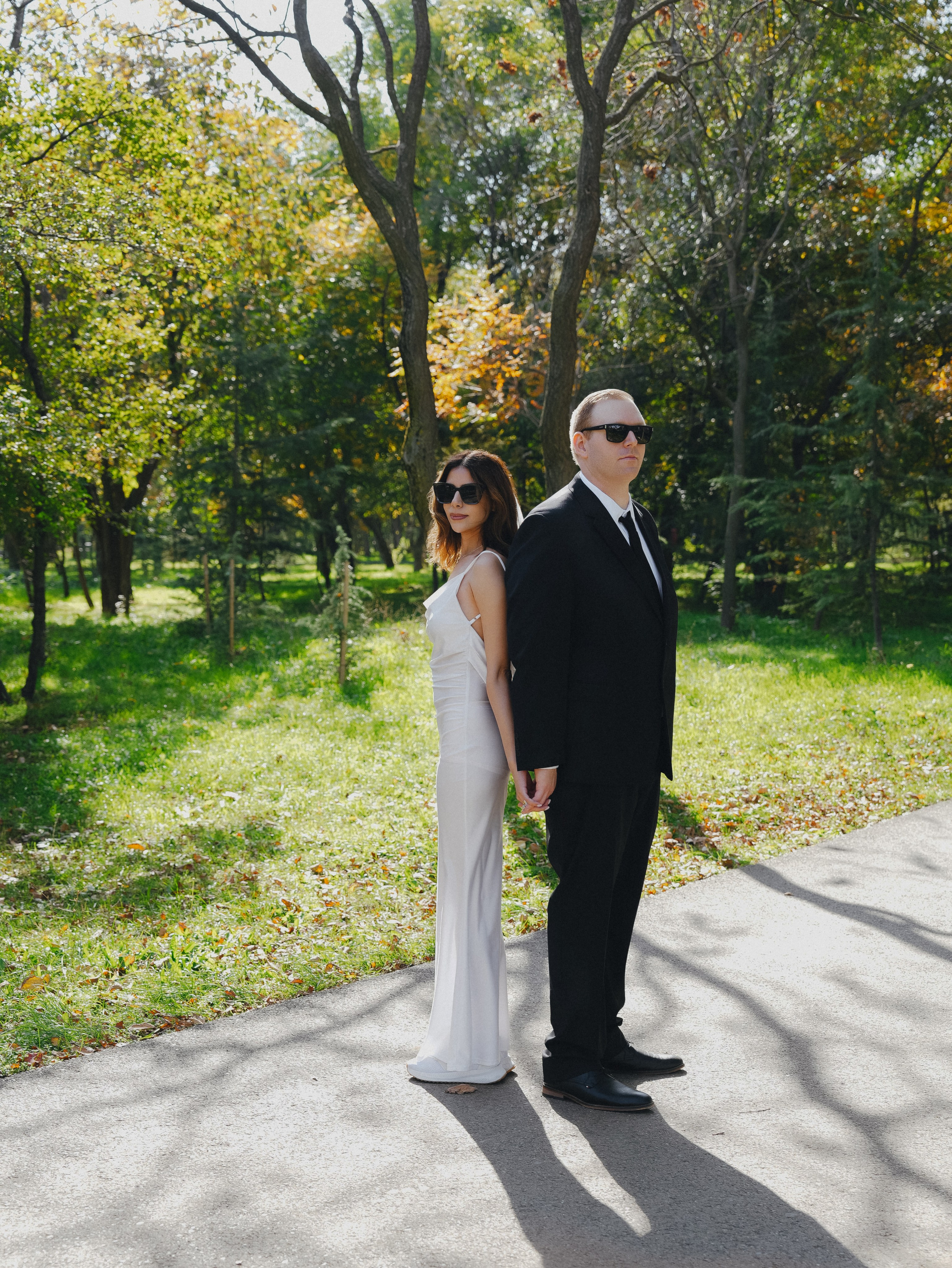 Couple under golden leaves at Lisi Lake, Tbilisi