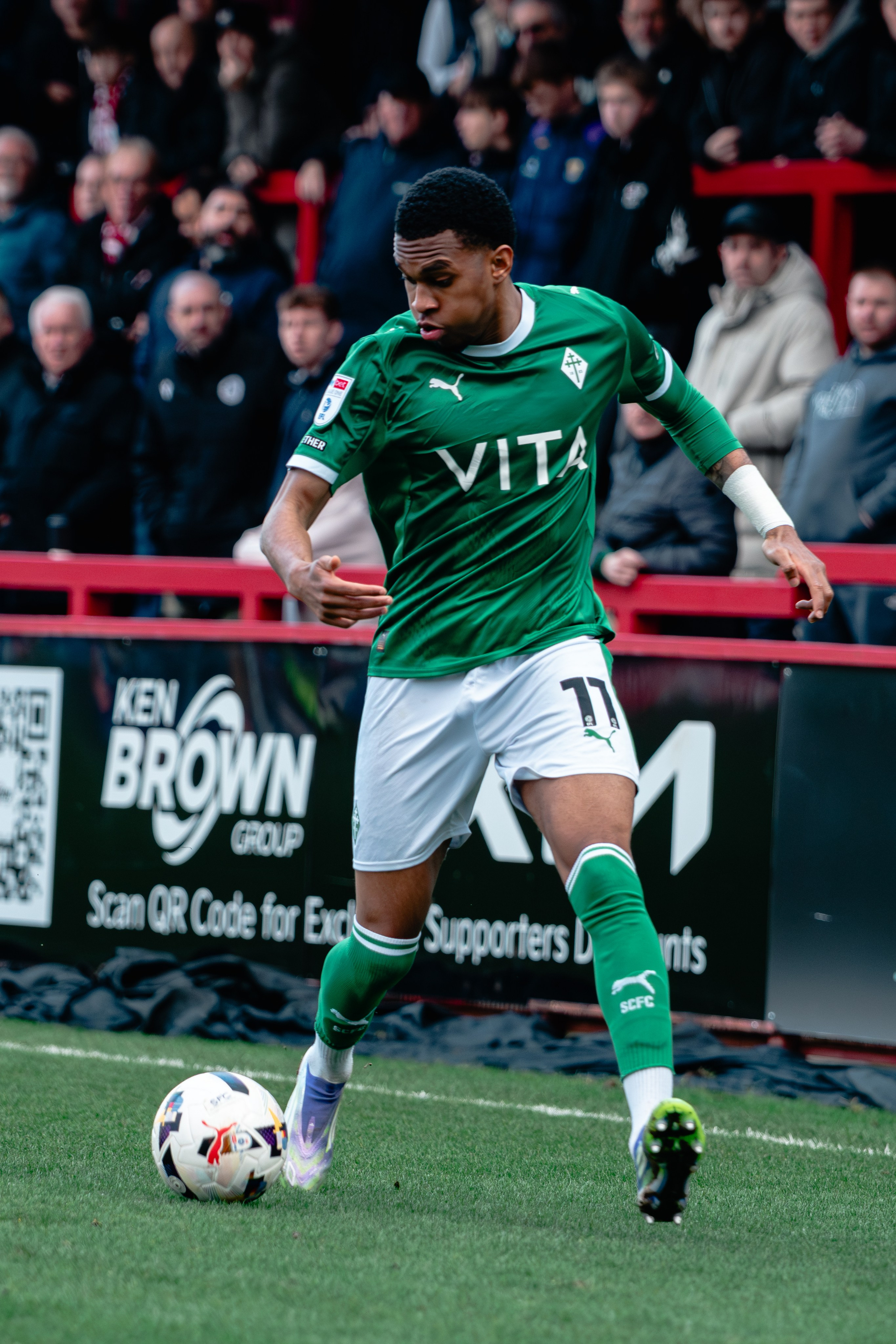Stockport County player dribbling with the ball during the League One fixture against Stevenage.