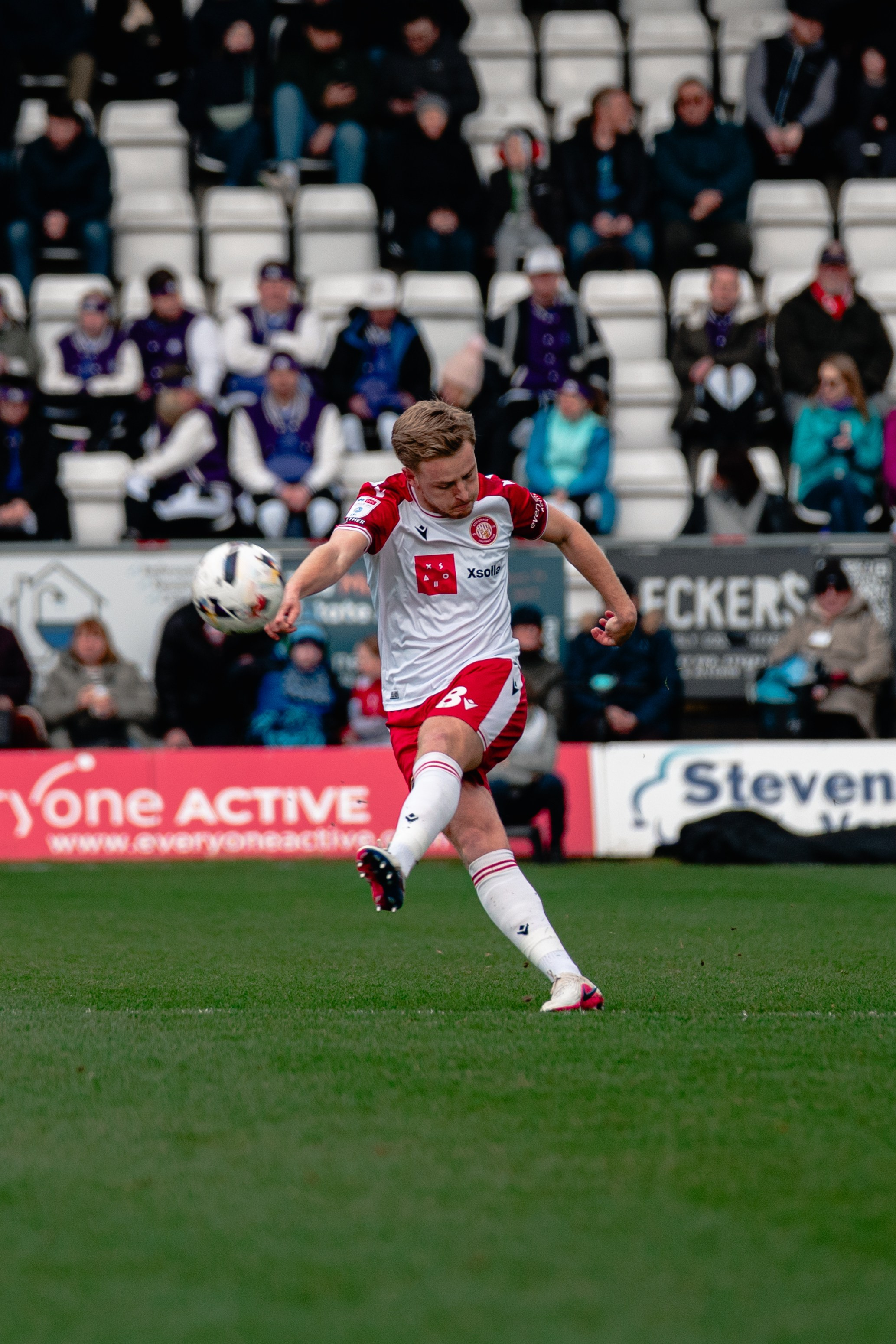 Stevenage player striking the ball during the League One match against Stockport County at the Lamex Stadium.