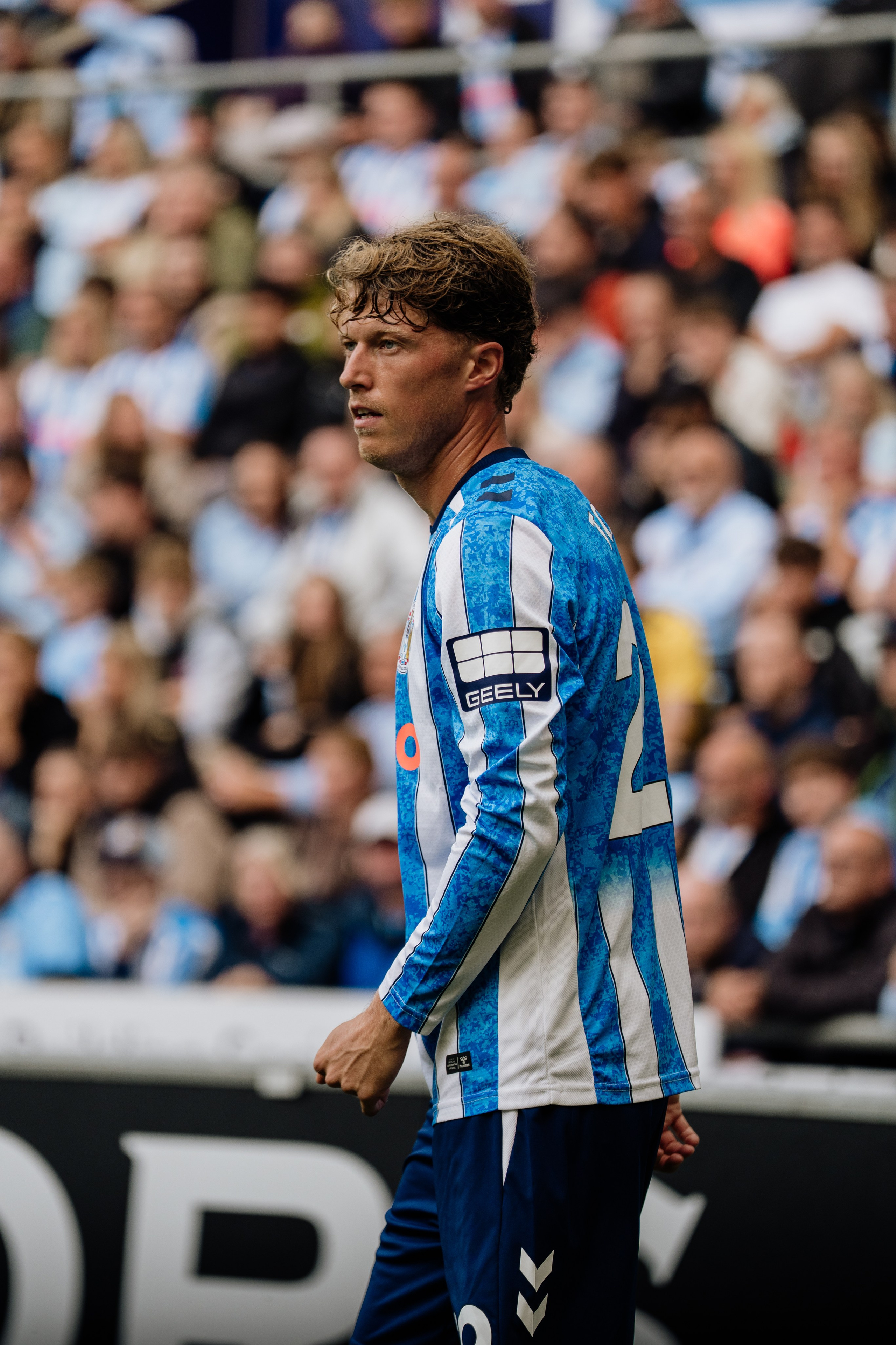 Coventry City player photographed during a professional football match in front of the home supporters.