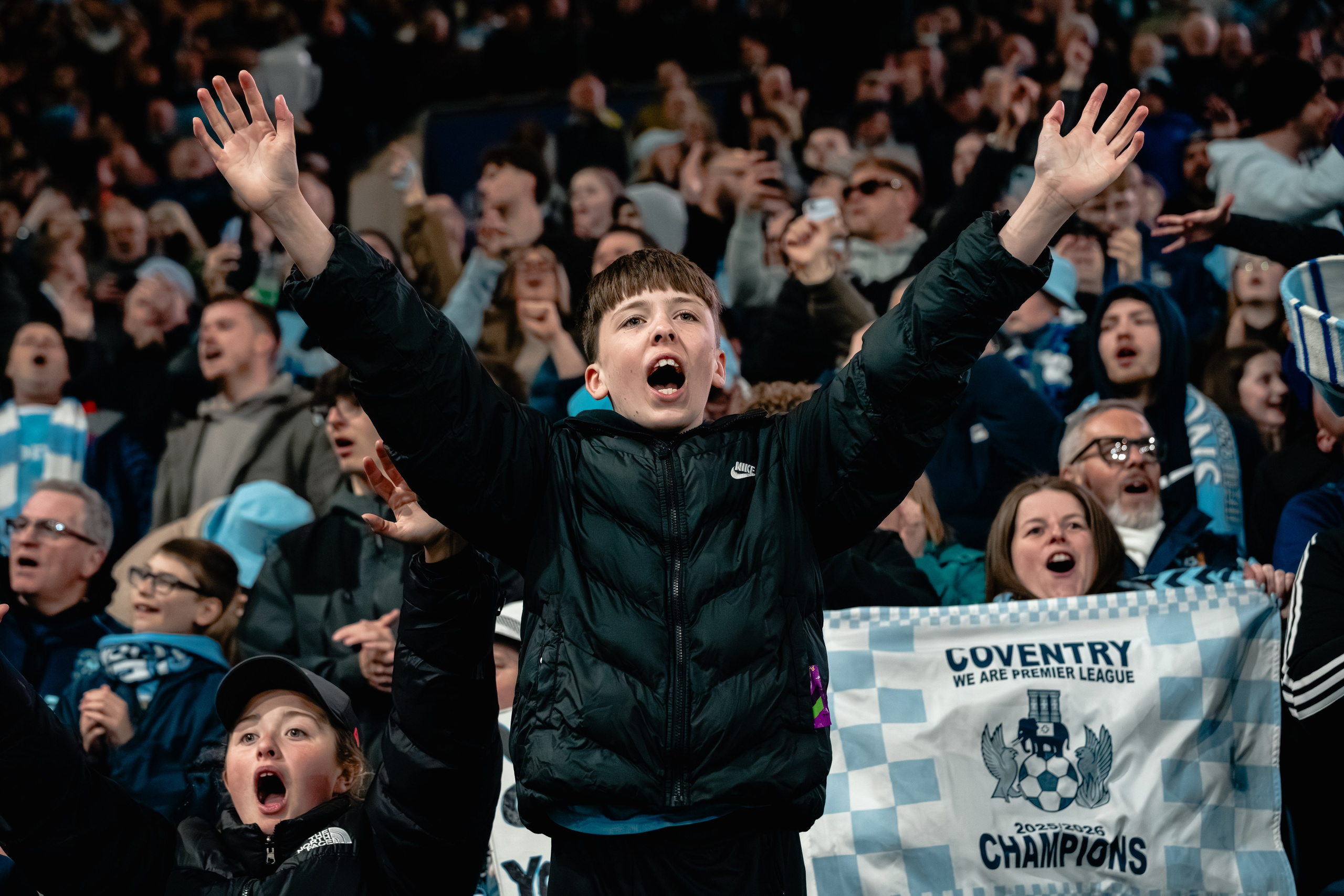 Coventry City supporters celebrating in the stands during the Championship title-clinching victory over Portsmouth