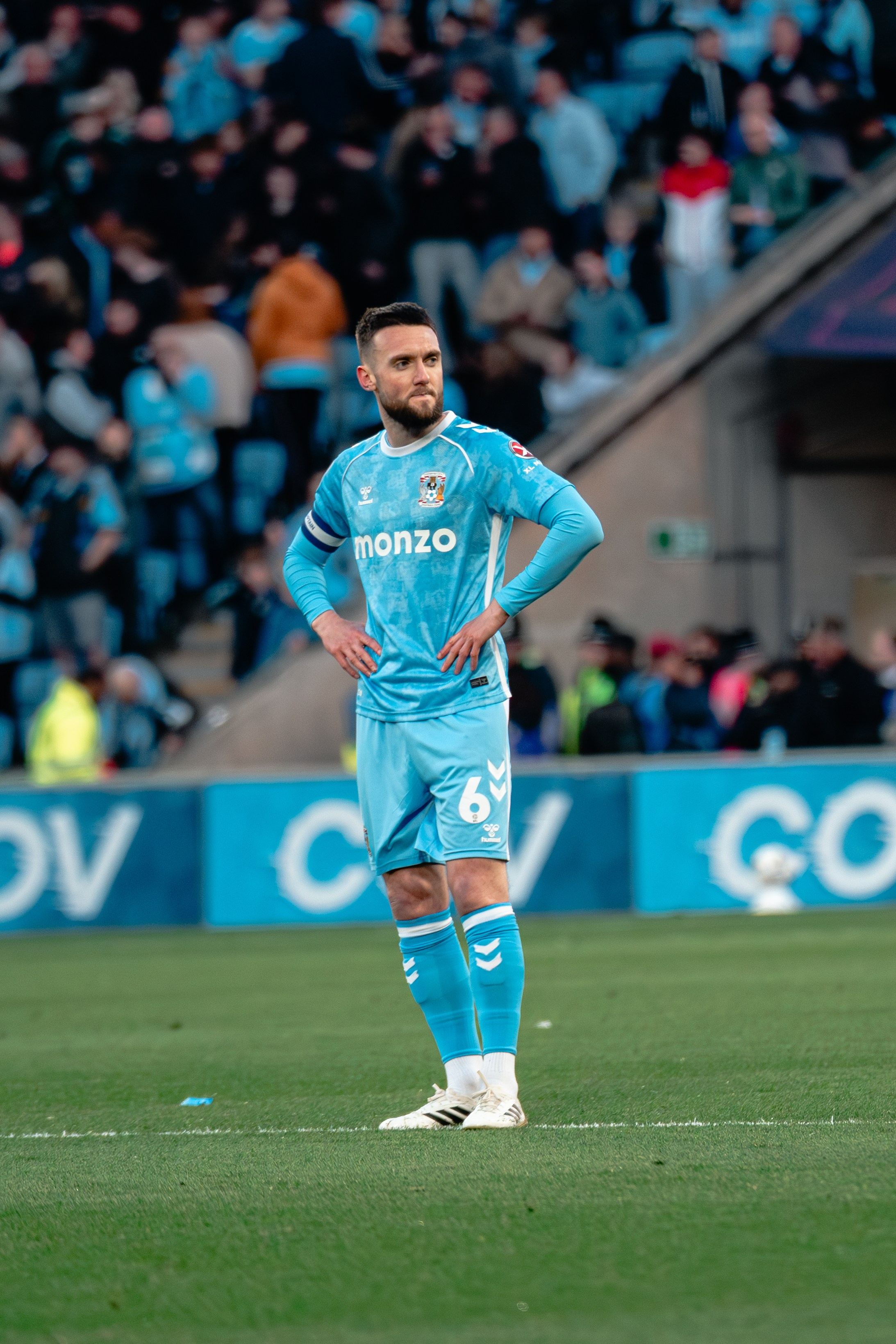 Coventry City player standing on the pitch during the Championship fixture against Portsmouth