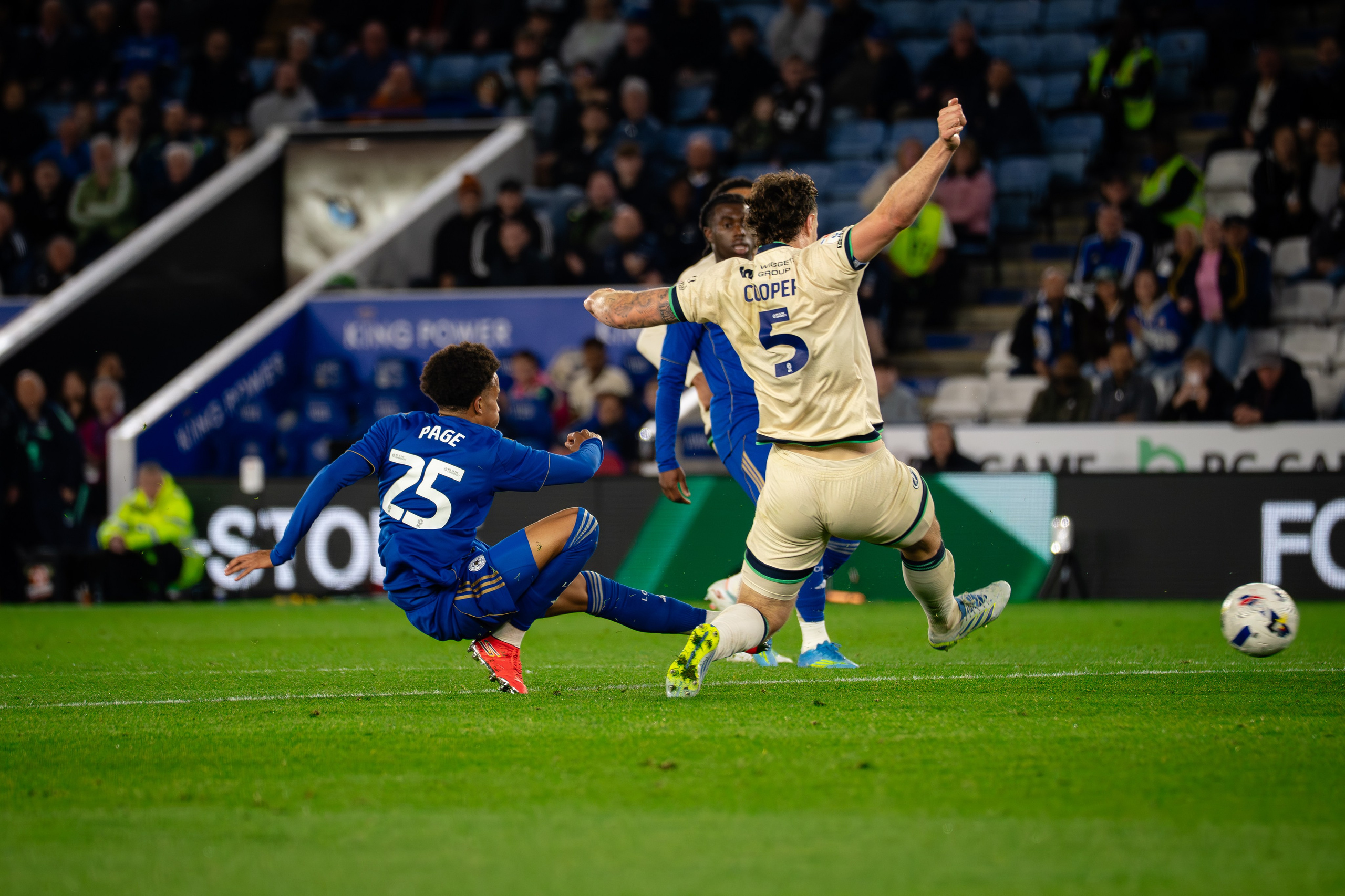 Leicester City and Millwall players competing for the ball near the penalty area during the Championship match at the King Power Stadium