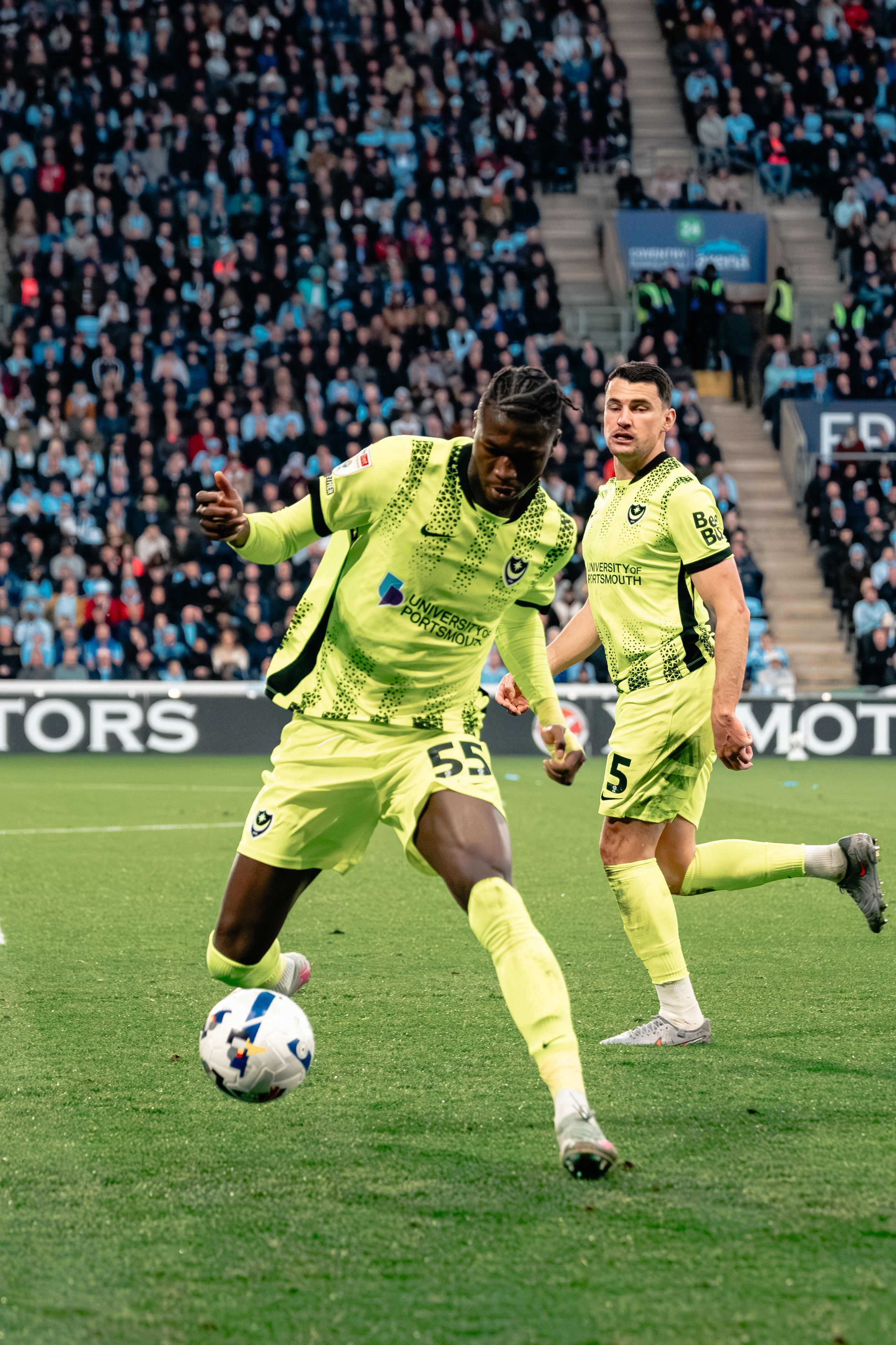 Goalkeeper in a bright green kit in action during Coventry City v Portsmouth at the Coventry Building Society Arena