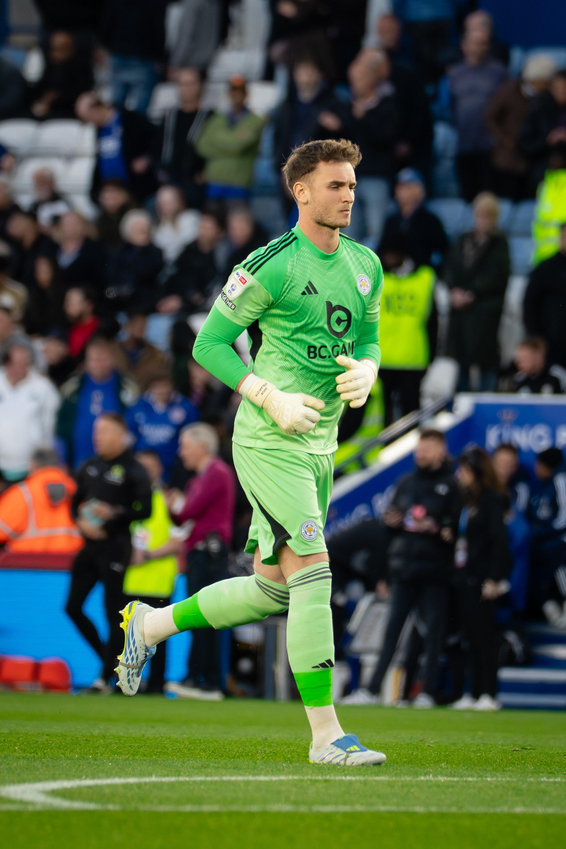 Leicester City goalkeeper in a green kit during the Championship match against Millwall