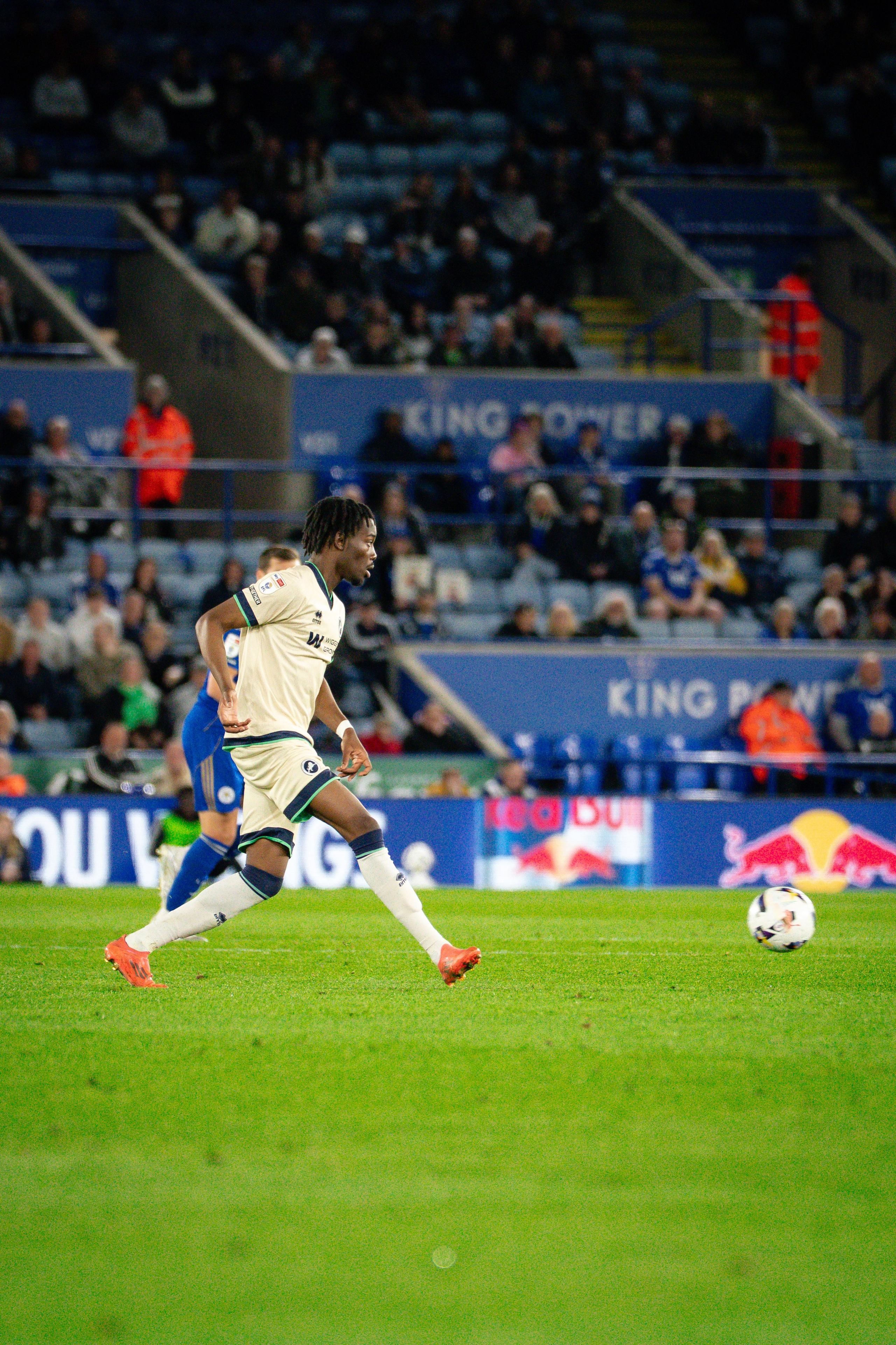 Leicester City and Millwall players competing for the ball during their Championship fixture.