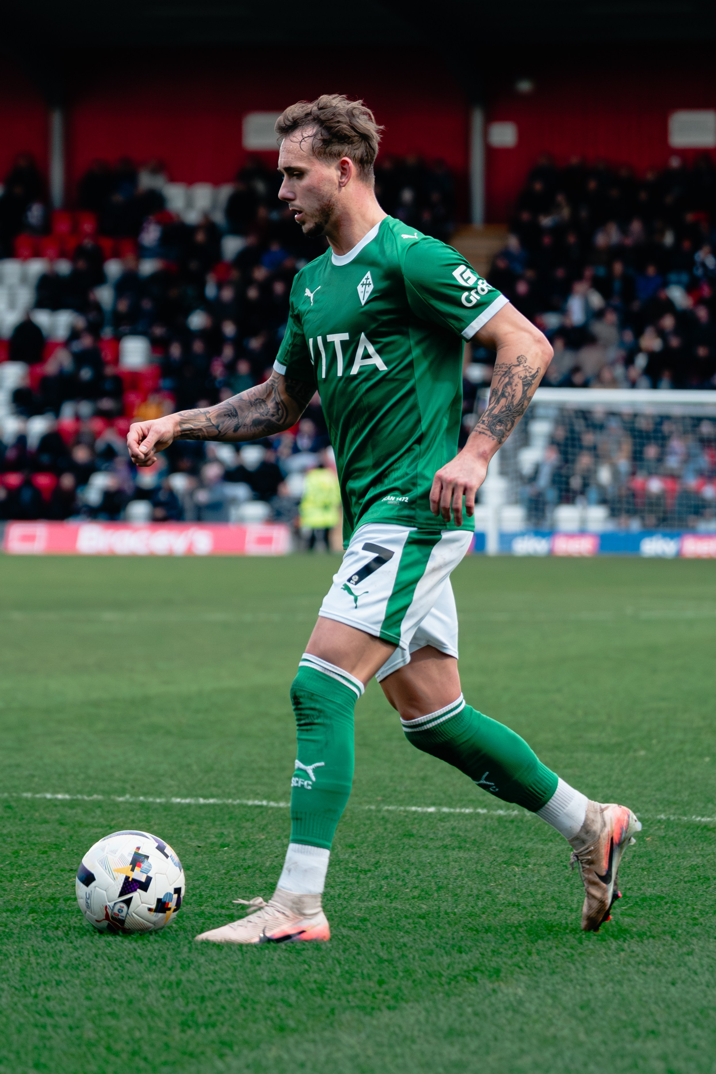 Stockport County player carrying the ball during the League One match against Stevenage on 28 February 2026.