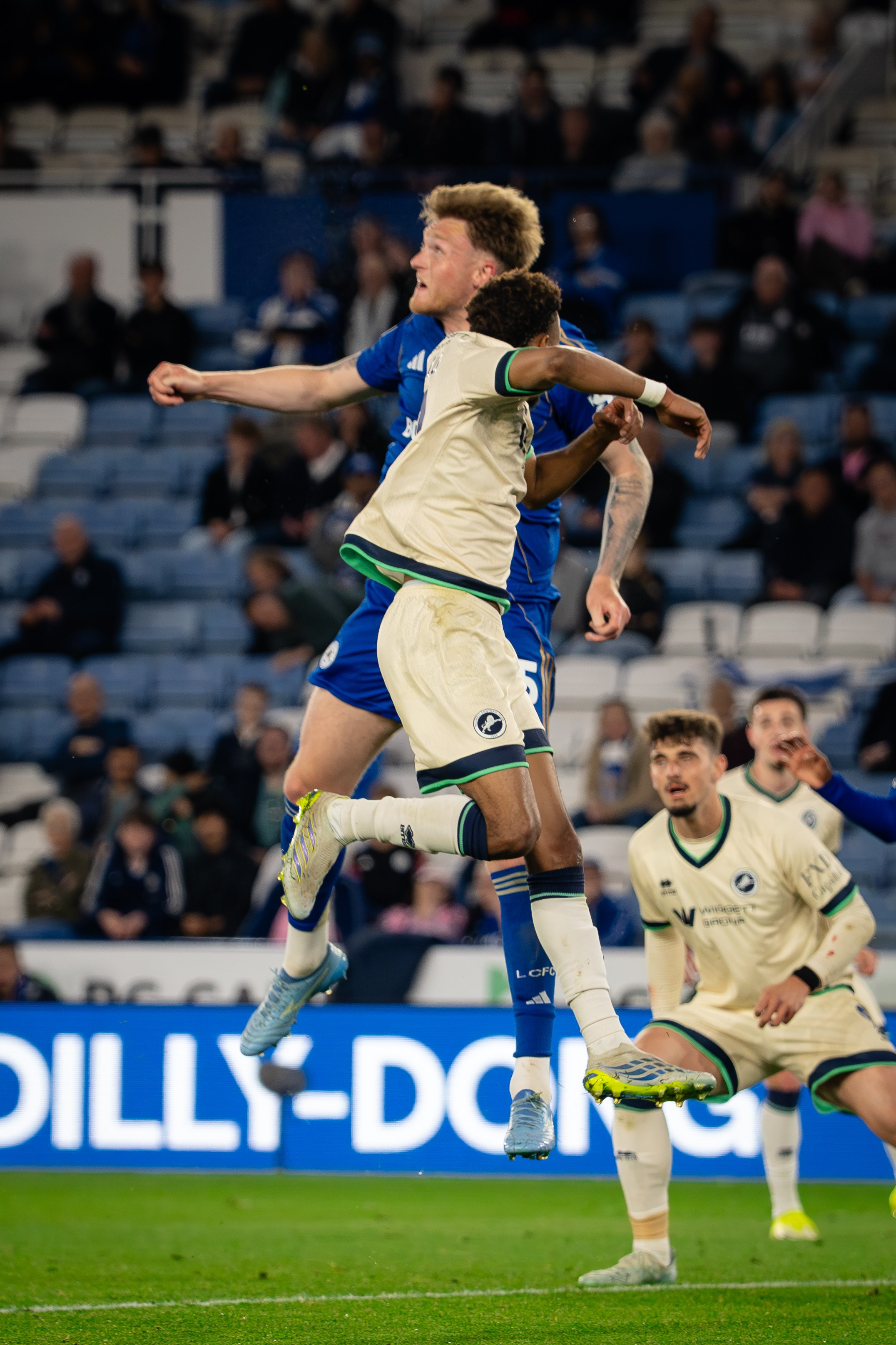 Millwall player challenging for the ball during the Championship fixture against Leicester City
