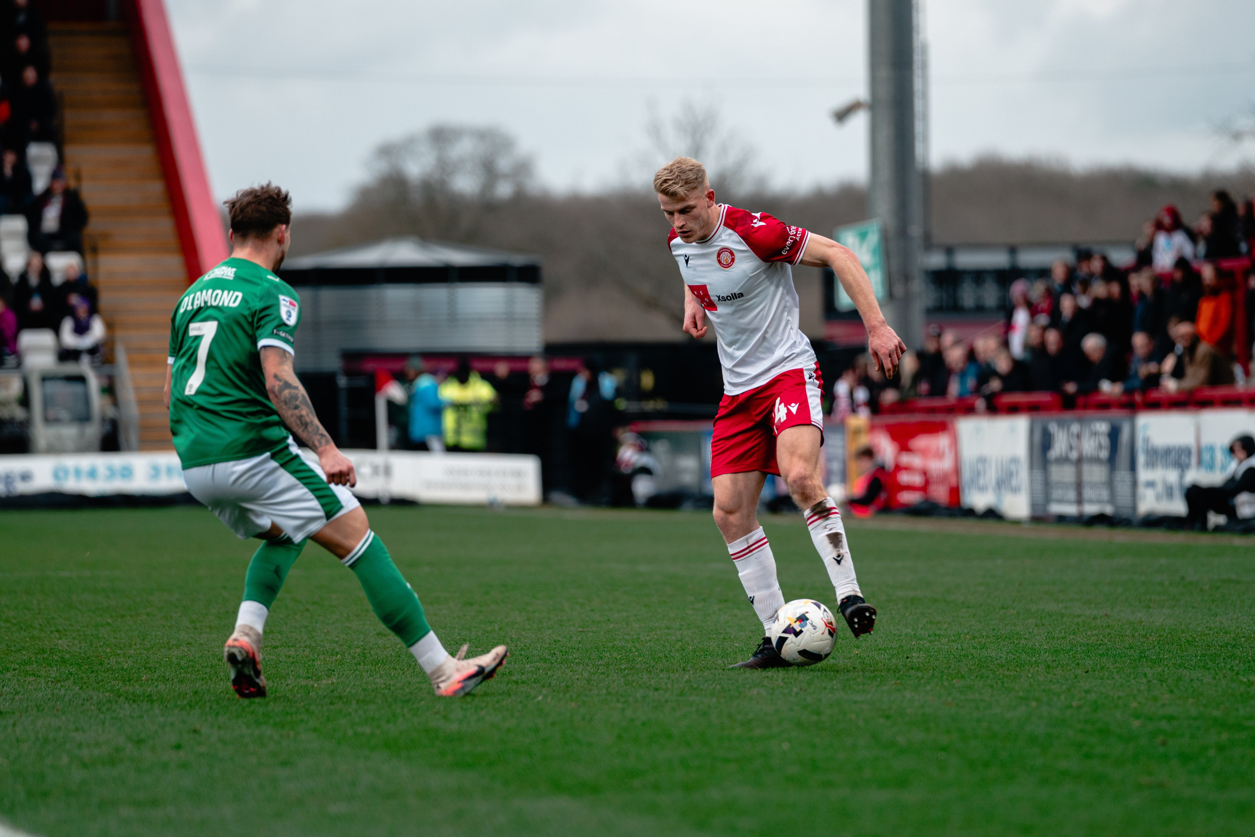 Stevenage and Stockport County players contesting the ball during their League One match at the Lamex Stadium.