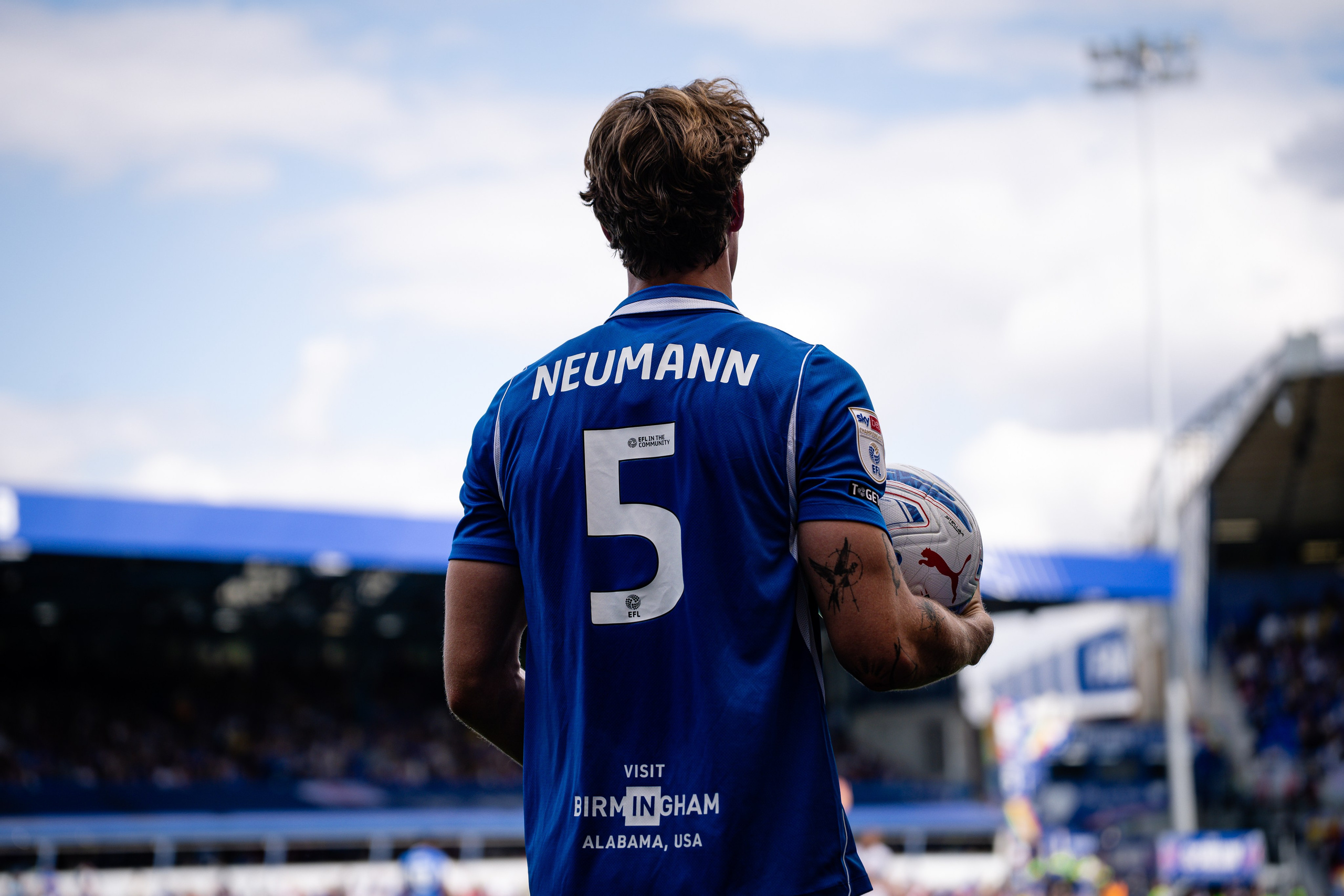 Phil Neumann of Birmingham City photographed from behind wearing number 5 during a professional football match.