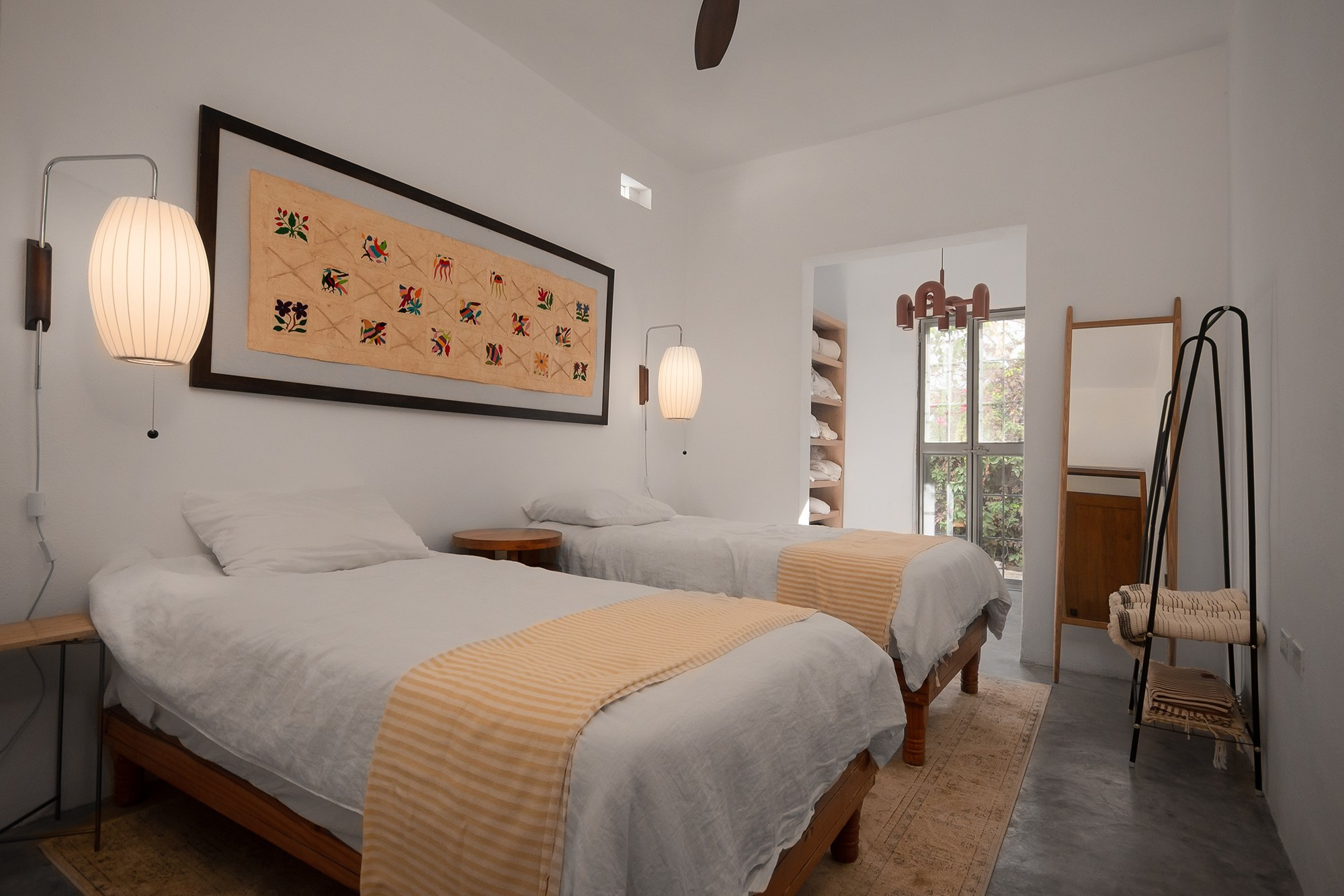 Guest bedroom in Los Cabos vacation home – double bed, garden view window and warm decorative details, Airbnb property photography