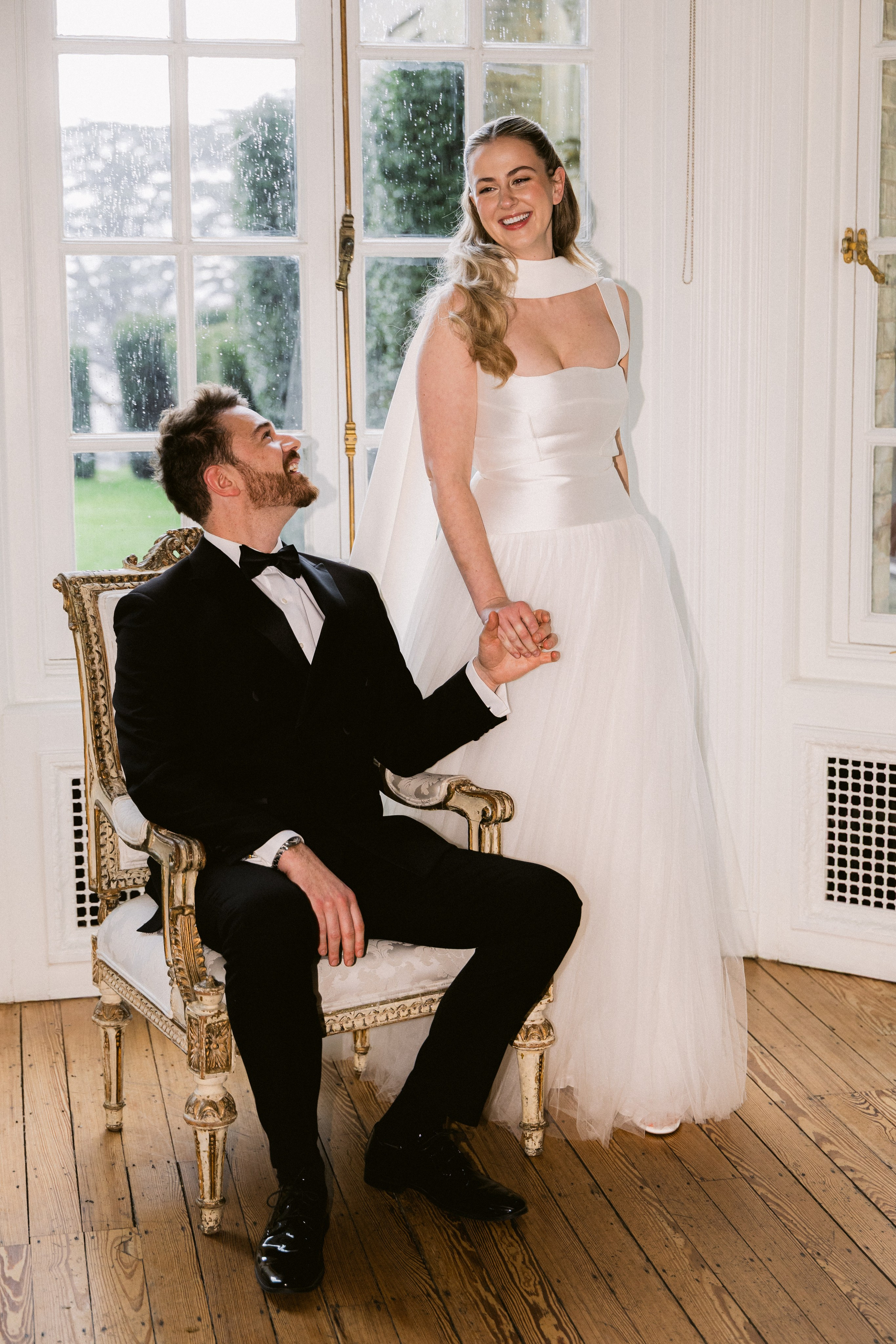	Bride and groom walking across the grand staircase at Hedsor House in elegant editorial style	•	Timeless couple portrait in front of Hedsor House facade during golden hour	•	Romantic photo of bride and groom in Hedsor’s gardens – classic UK wedding venue	•	Editorial wedding portrait with flowing veil and soft light in Hedsor House grounds
