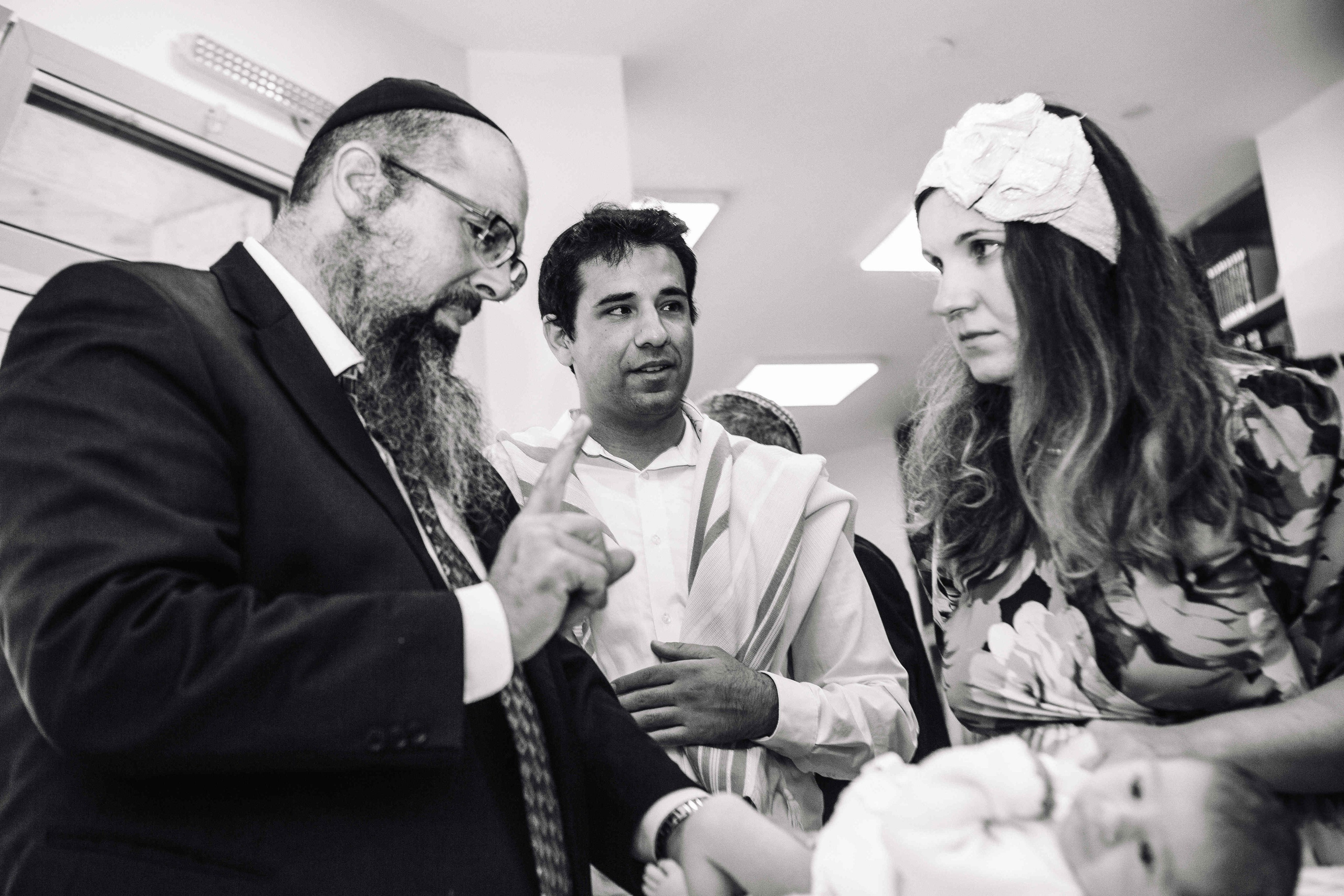 BRITH MILA IN THE SMALL SYNAGOGUE. PHOTOGRAPHER IN ISRAEL