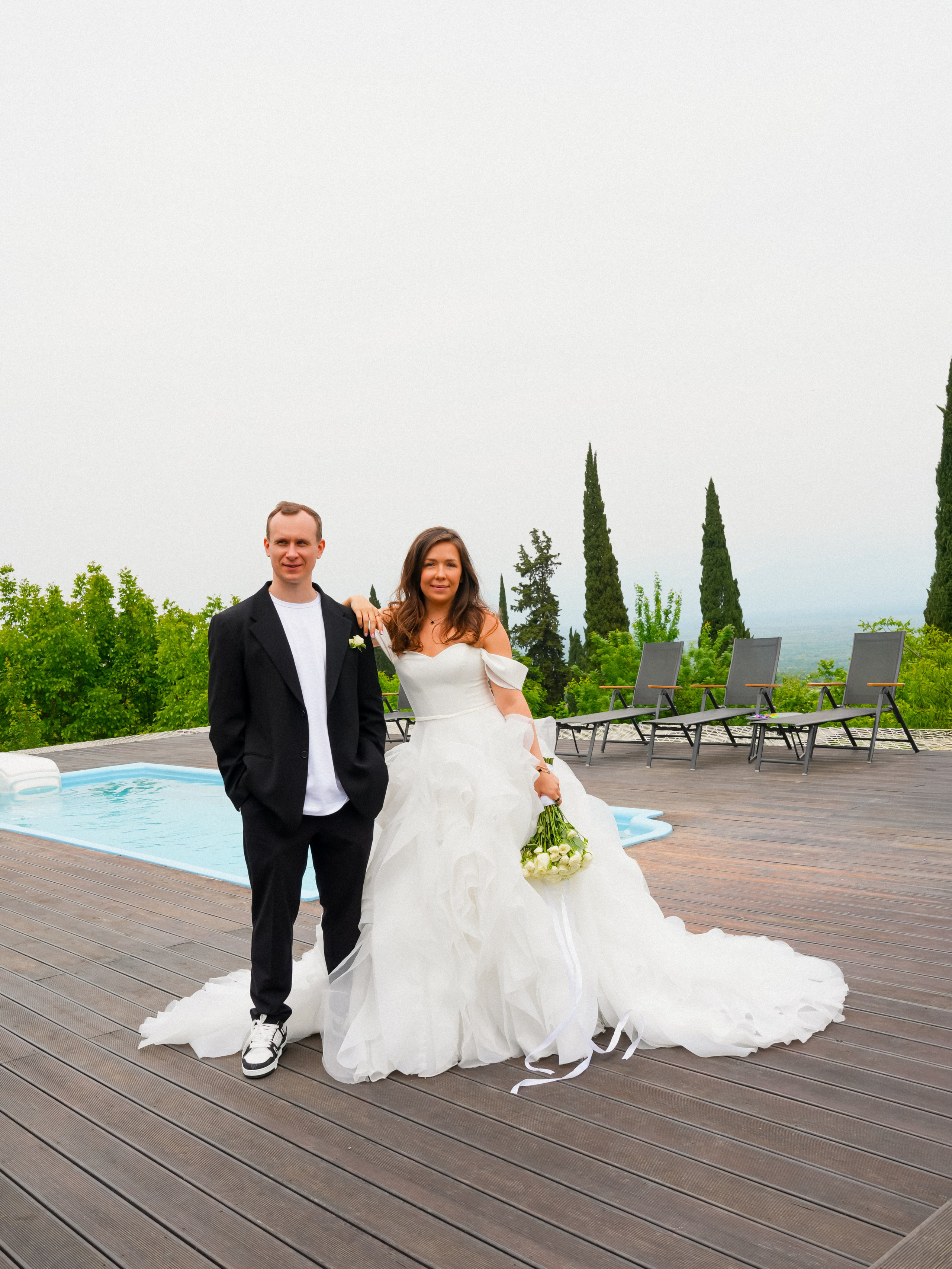 Couple near pool after ceremony moment