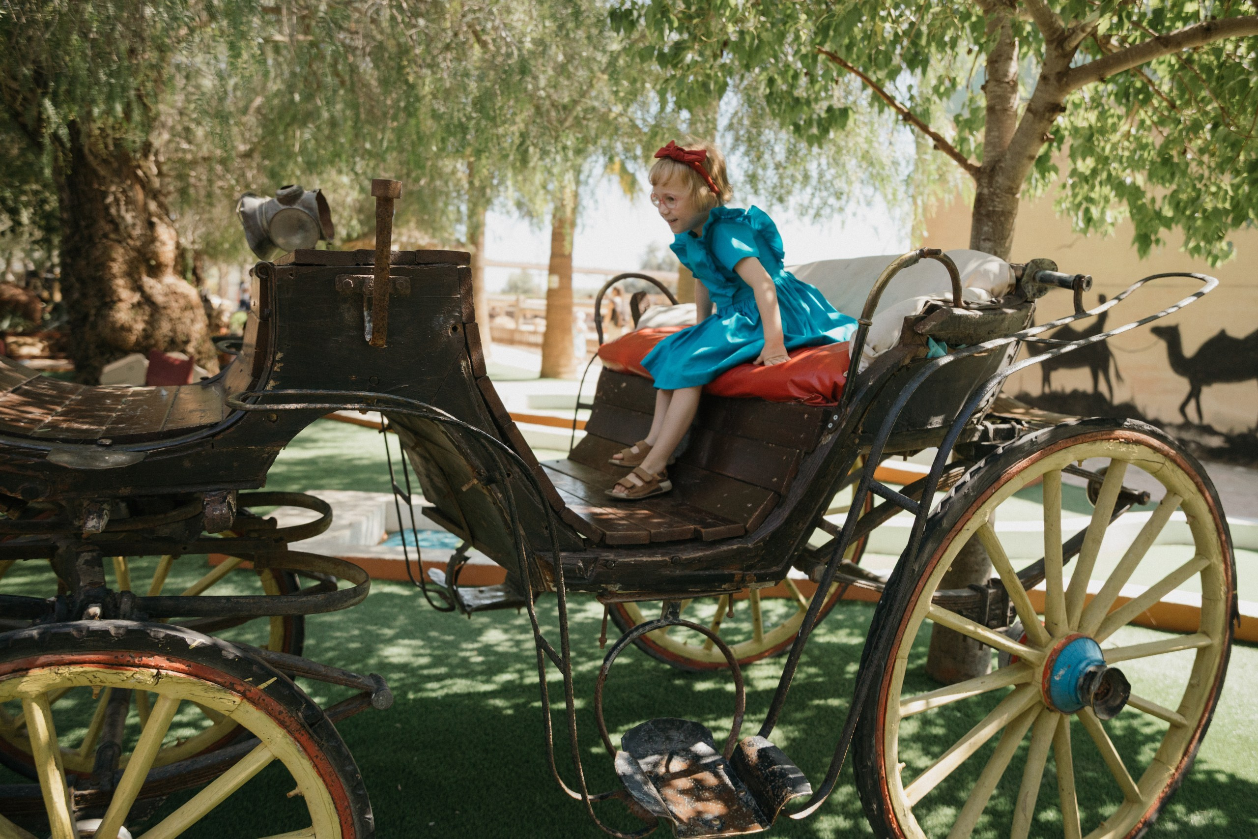 Joyful Moments in Camel park: Olya and Ada’s Day of Fun and Adventure, sliding and riding camels. Photographer in Barcelona capturing unique stories | Kate Chumak