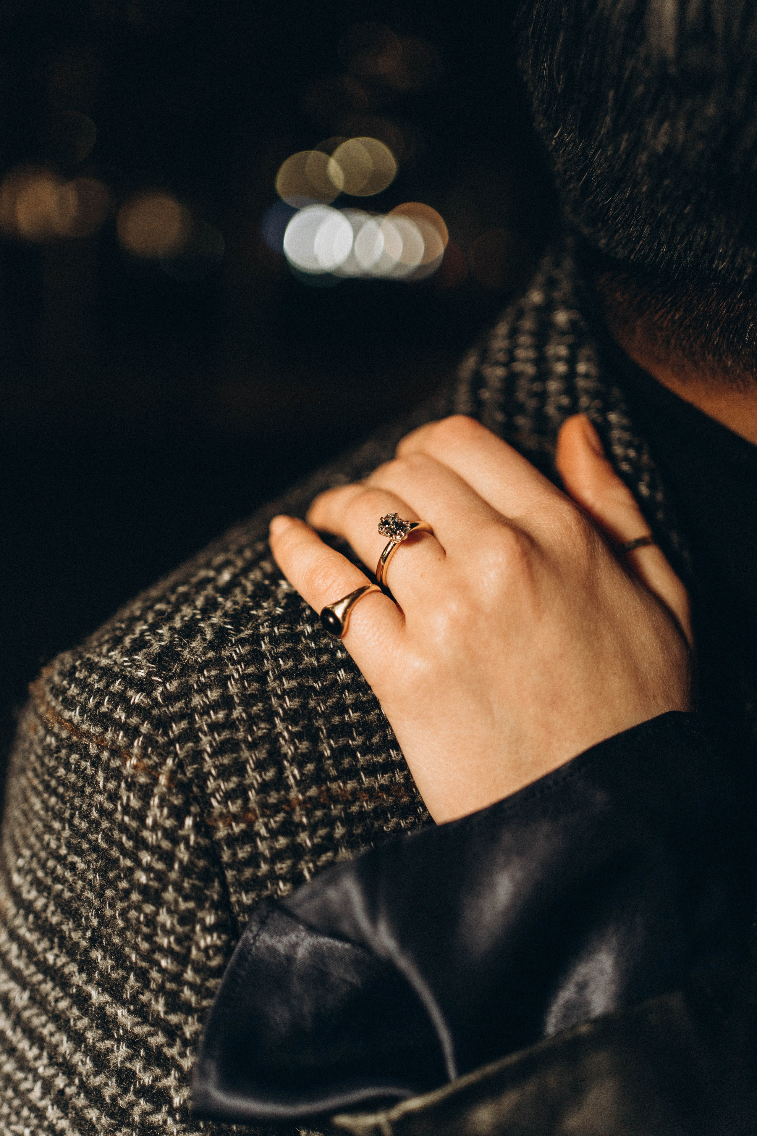 Engagement moment in Central Park snowy evening.Proposal in Dumbo with Manhattan skyline at night.