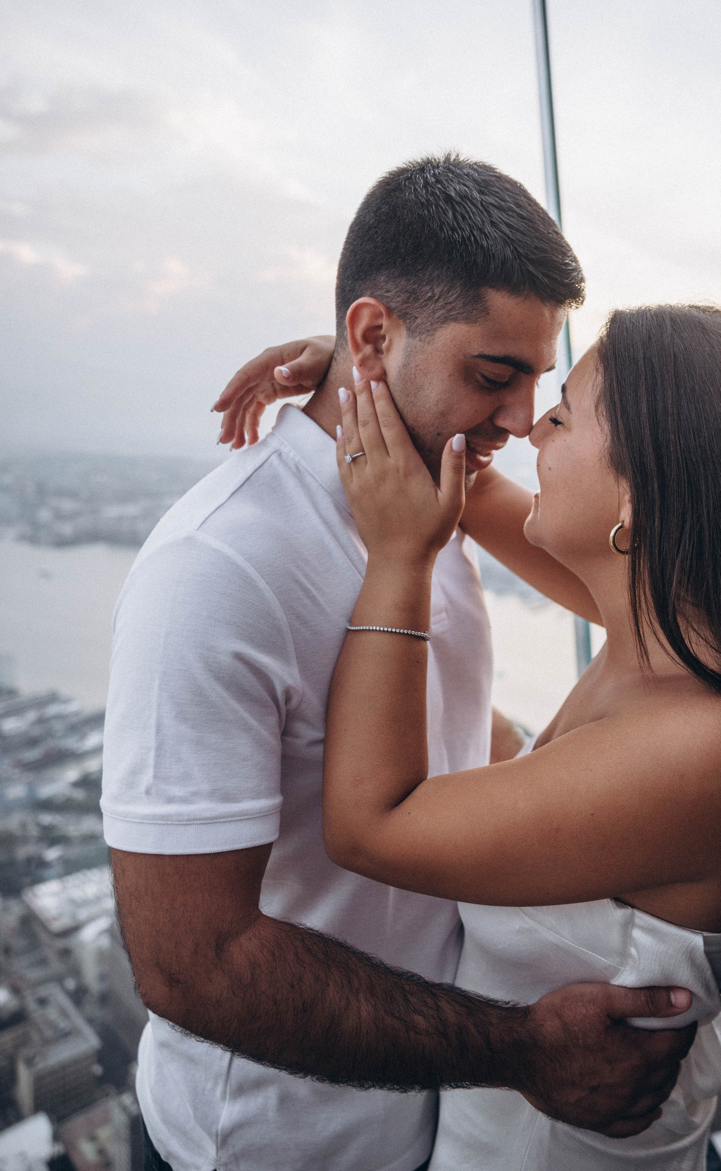 Proposal at Empire State Building with night city lights.
