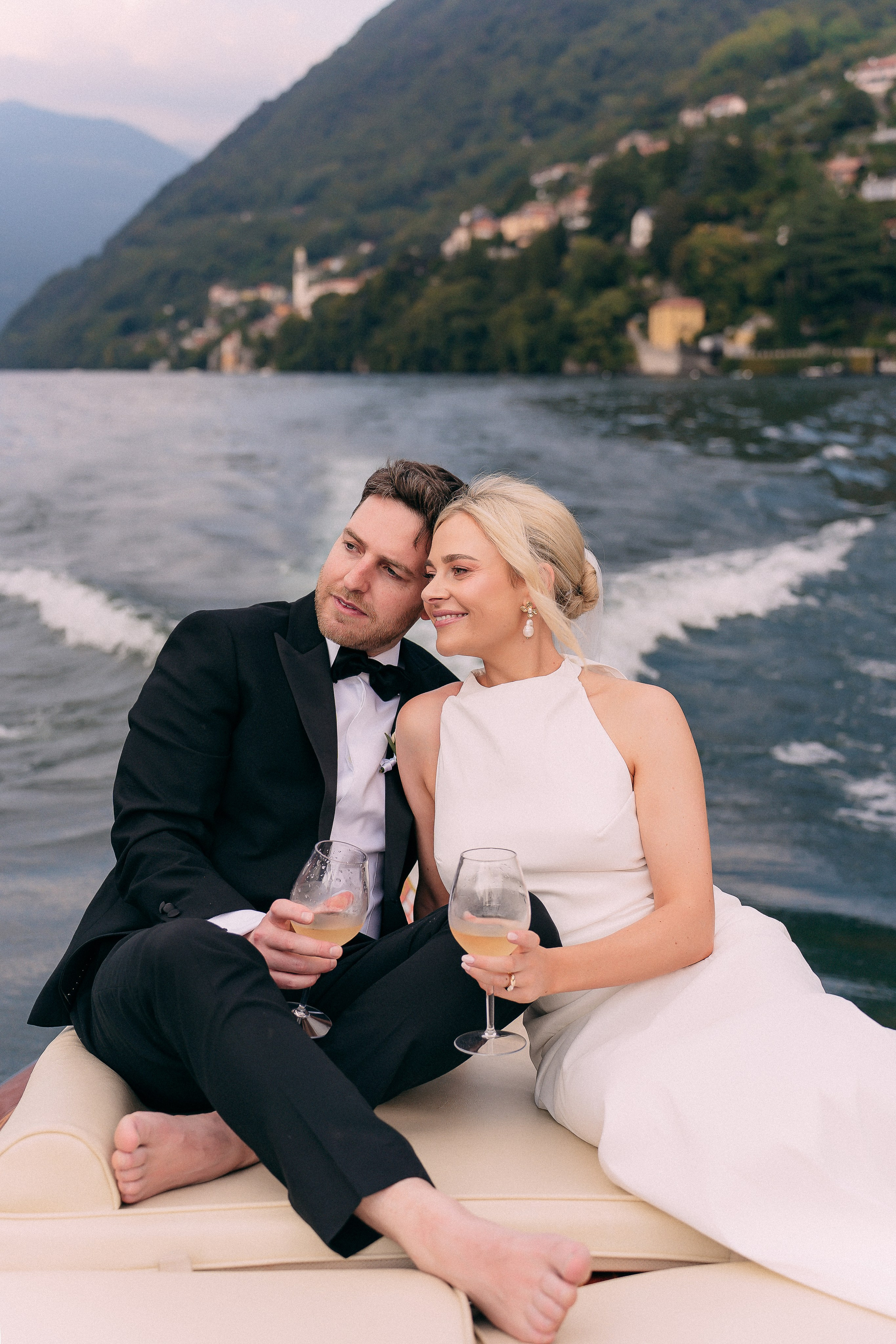 Bride and groom relaxing on the boat at Villa Lario, Lake Como, Italy