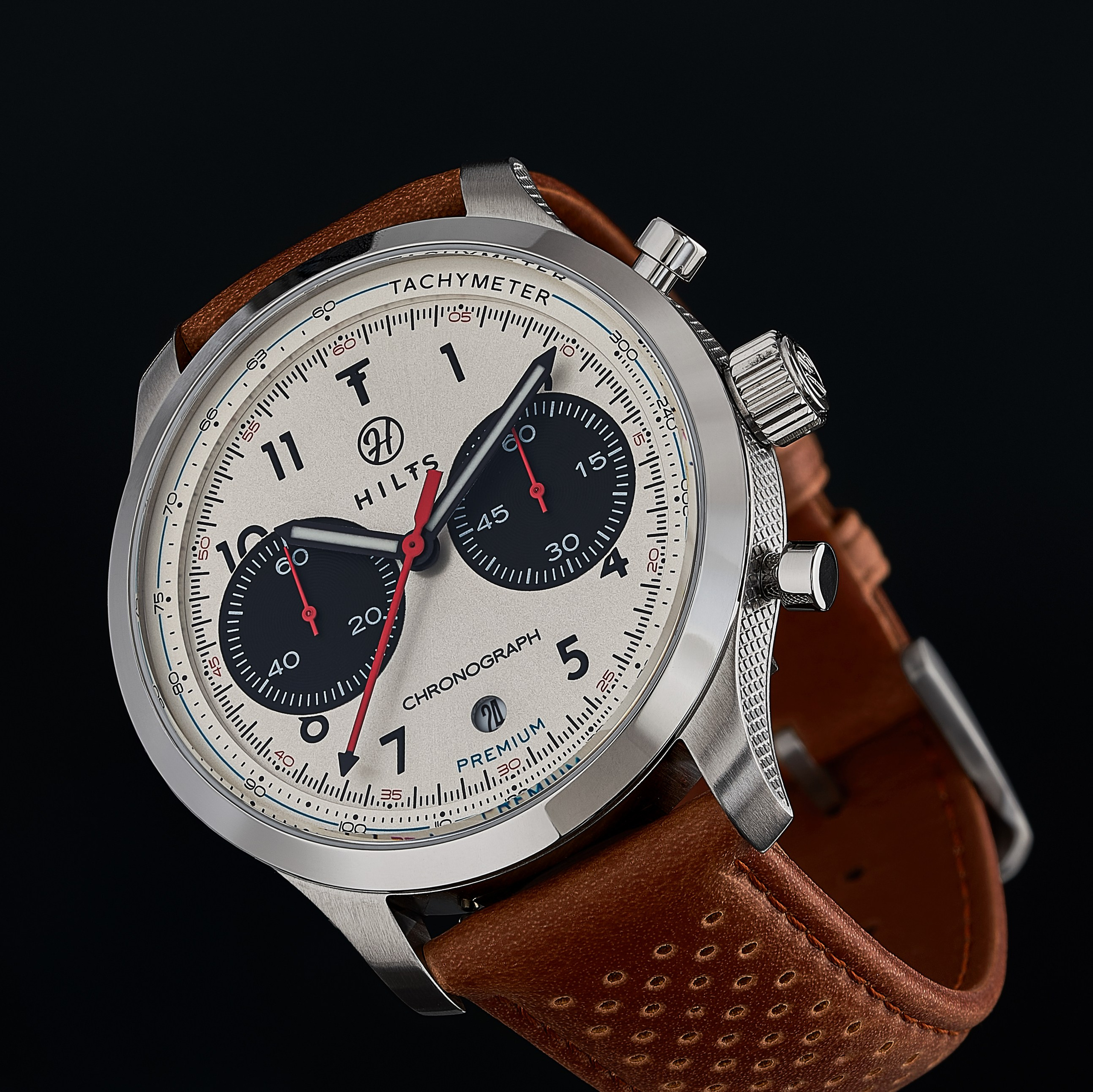 Watch chronograph with silver dial on a perforated tan leather strap