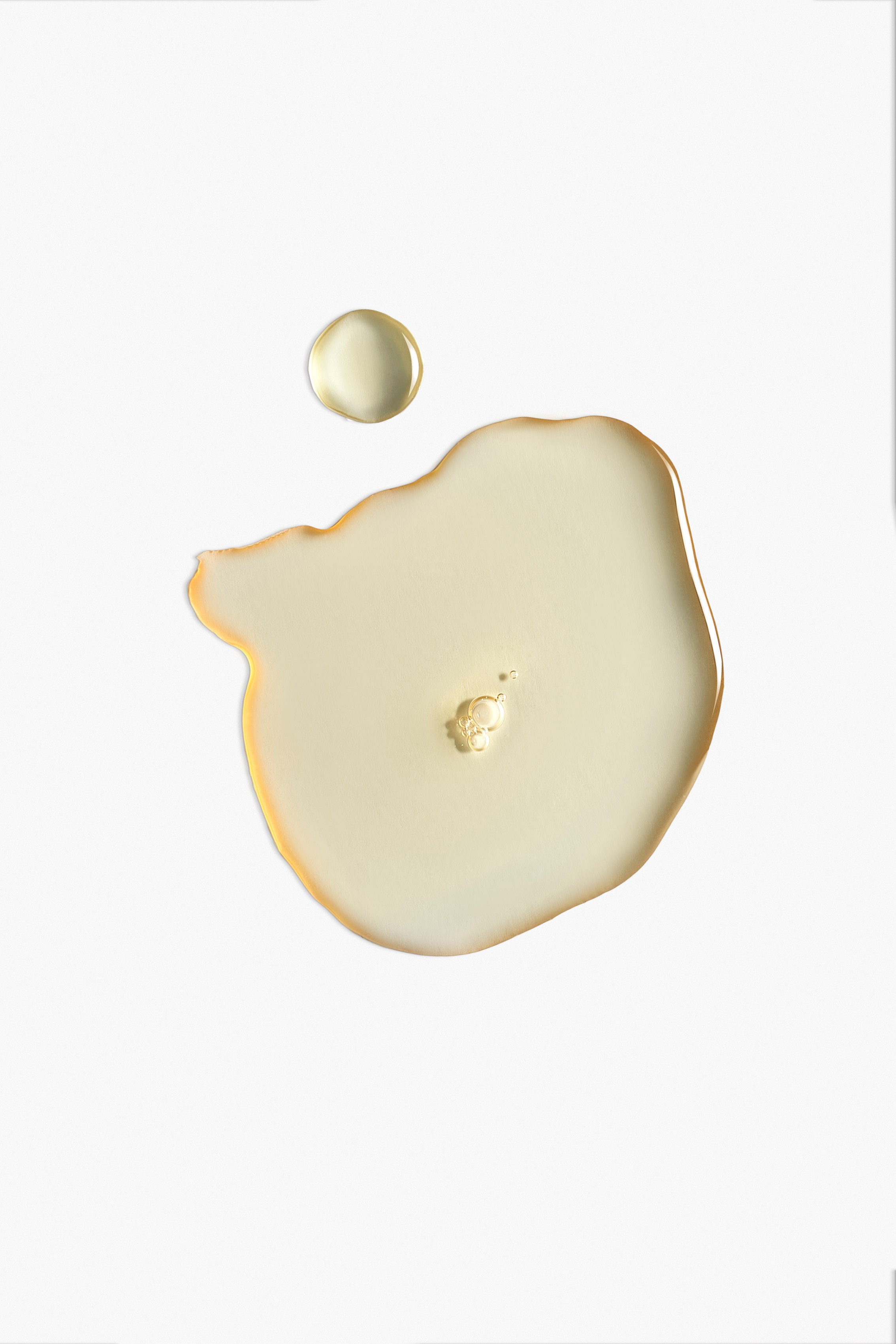 Oil drops with a clean edge on a light background