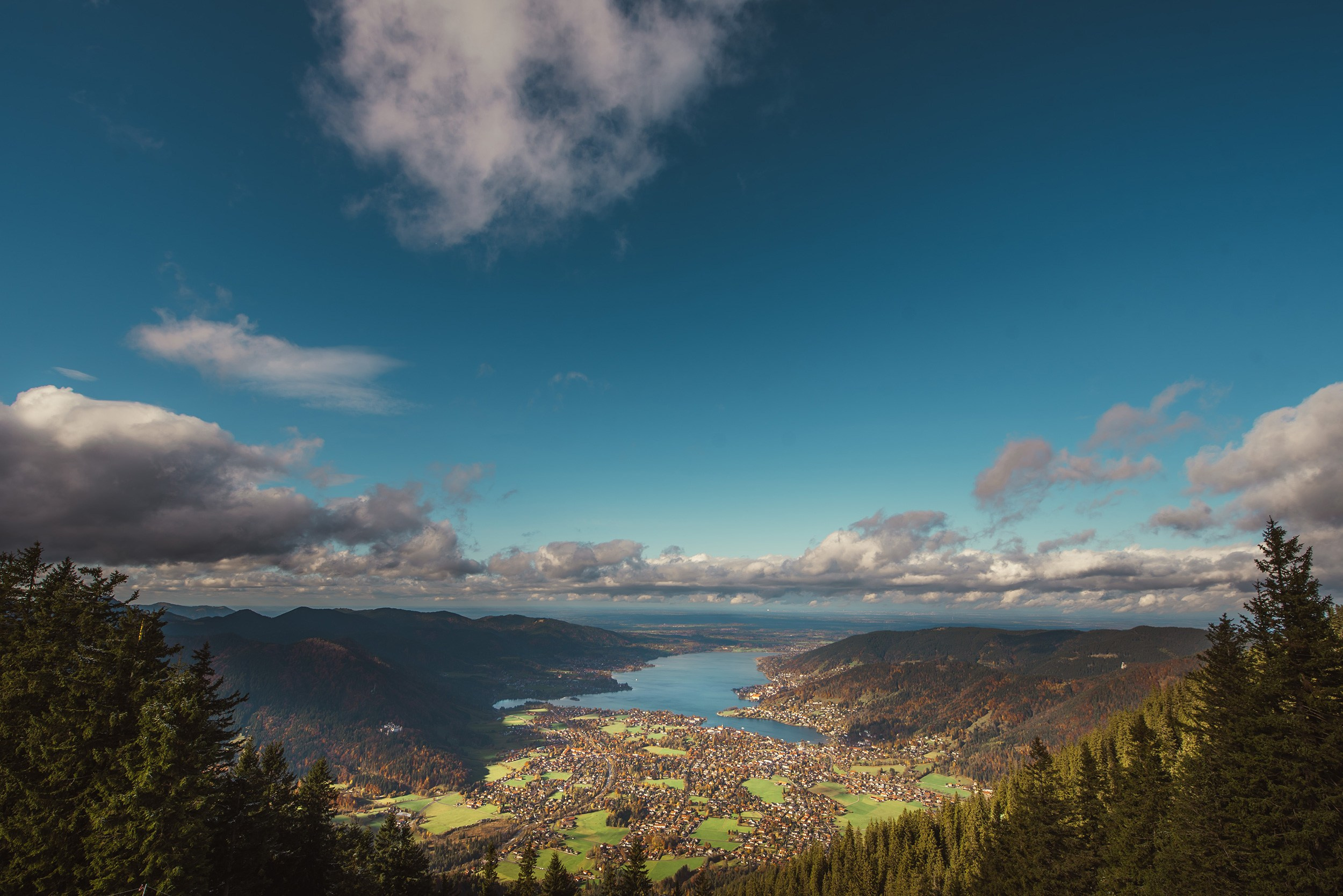 Panoramic view of Lake Tegernsee and the valley from the heights of Mount Wallberg.
