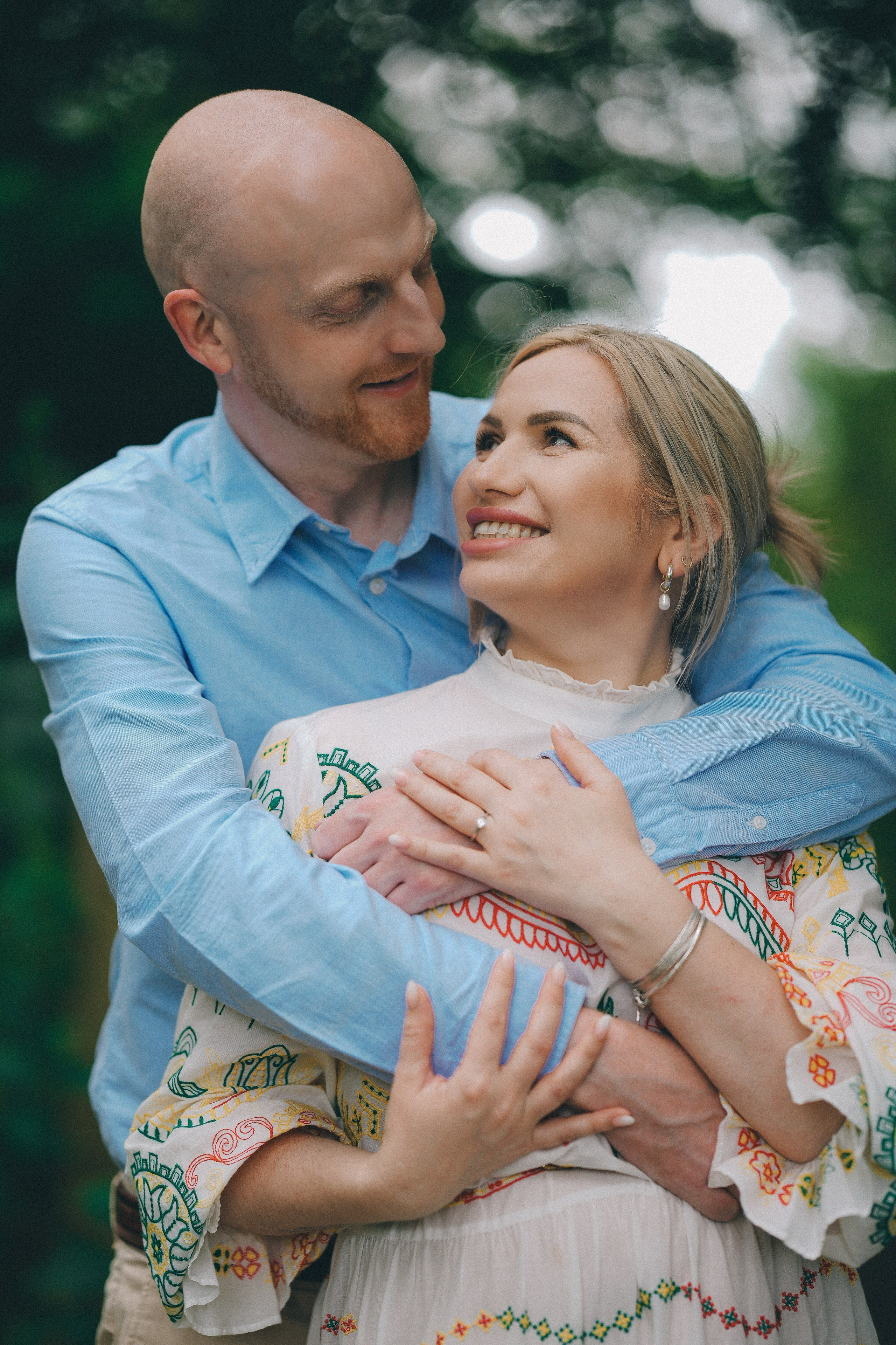 Expecting couple embracing during a maternity photography session in Solihull