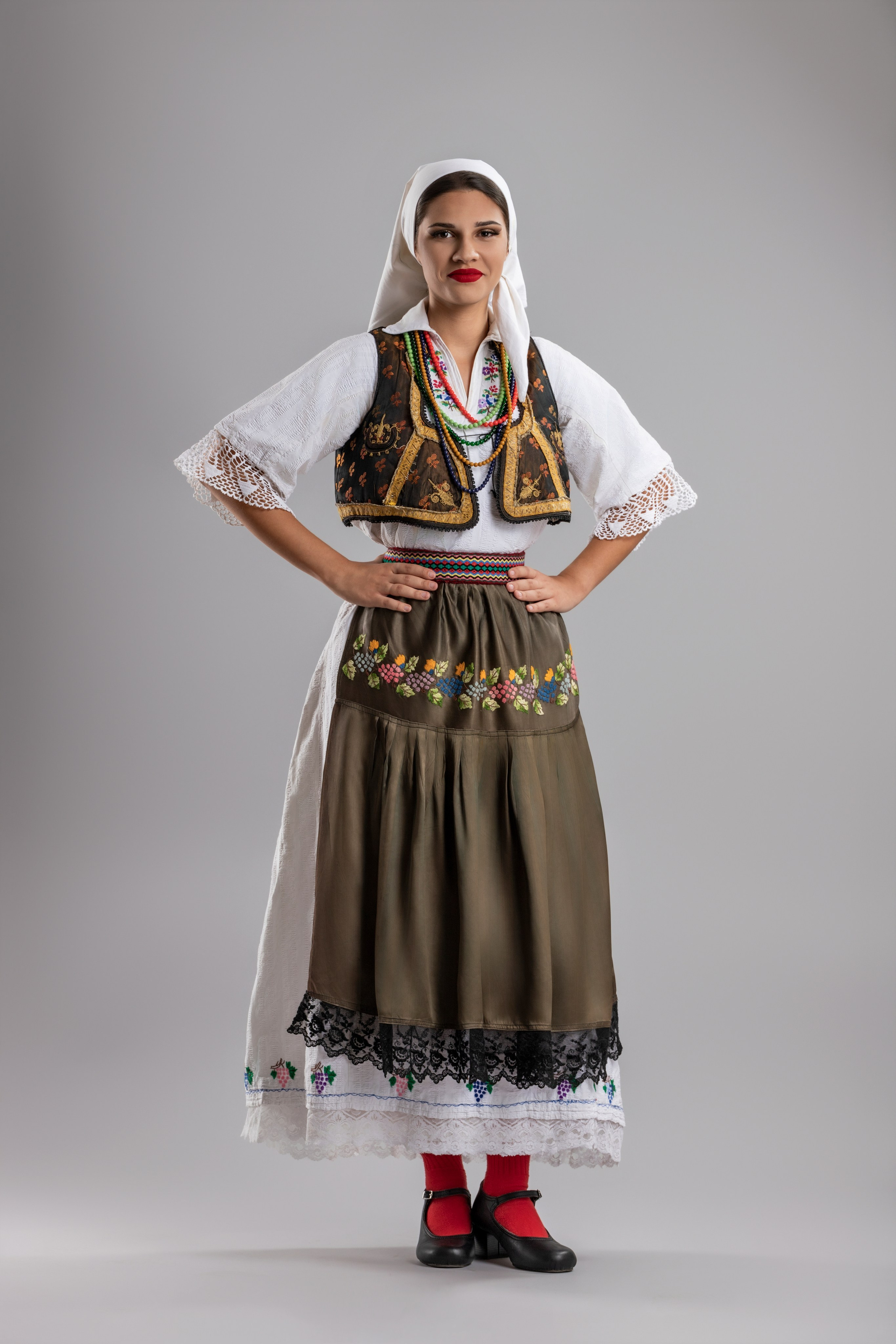 Studio portrait photography of traditional folk costumes from Bosnia and Herzegovina featuring authentic cultural clothing, embroidery, jewelry and handcrafted garments, photographed by Namir Čomaga. The images highlight the richness, craftsmanship and cultural heritage of Bosnian traditional costumes through carefully lit studio portraits.