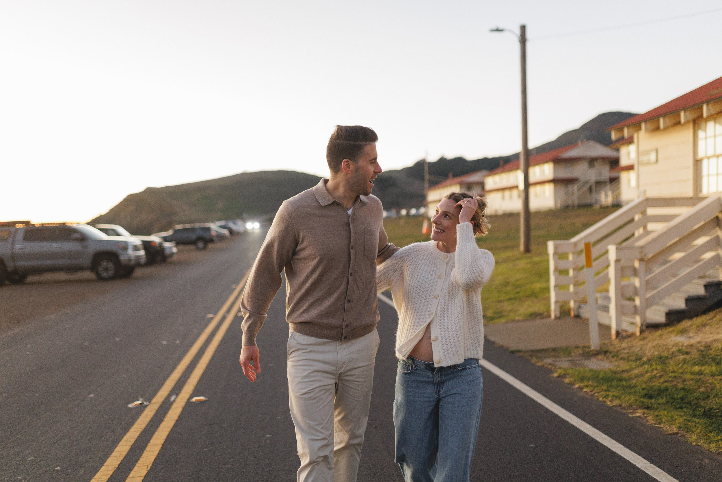 Artistic maternity portrait at Rodeo Beach with Pacific Ocean and coastal wind