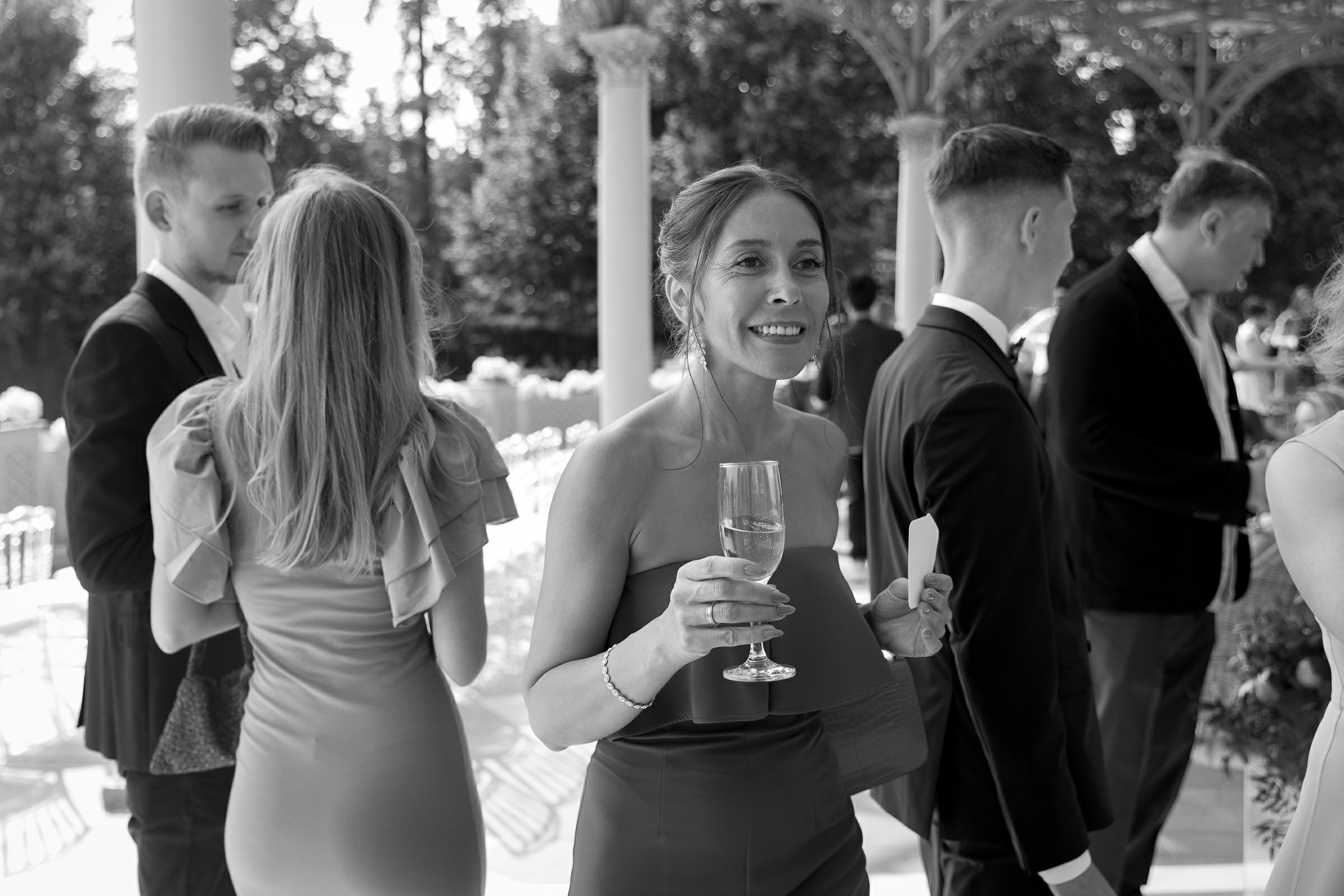 Guests smiling at ceremony, by Cornwall editorial photographer.