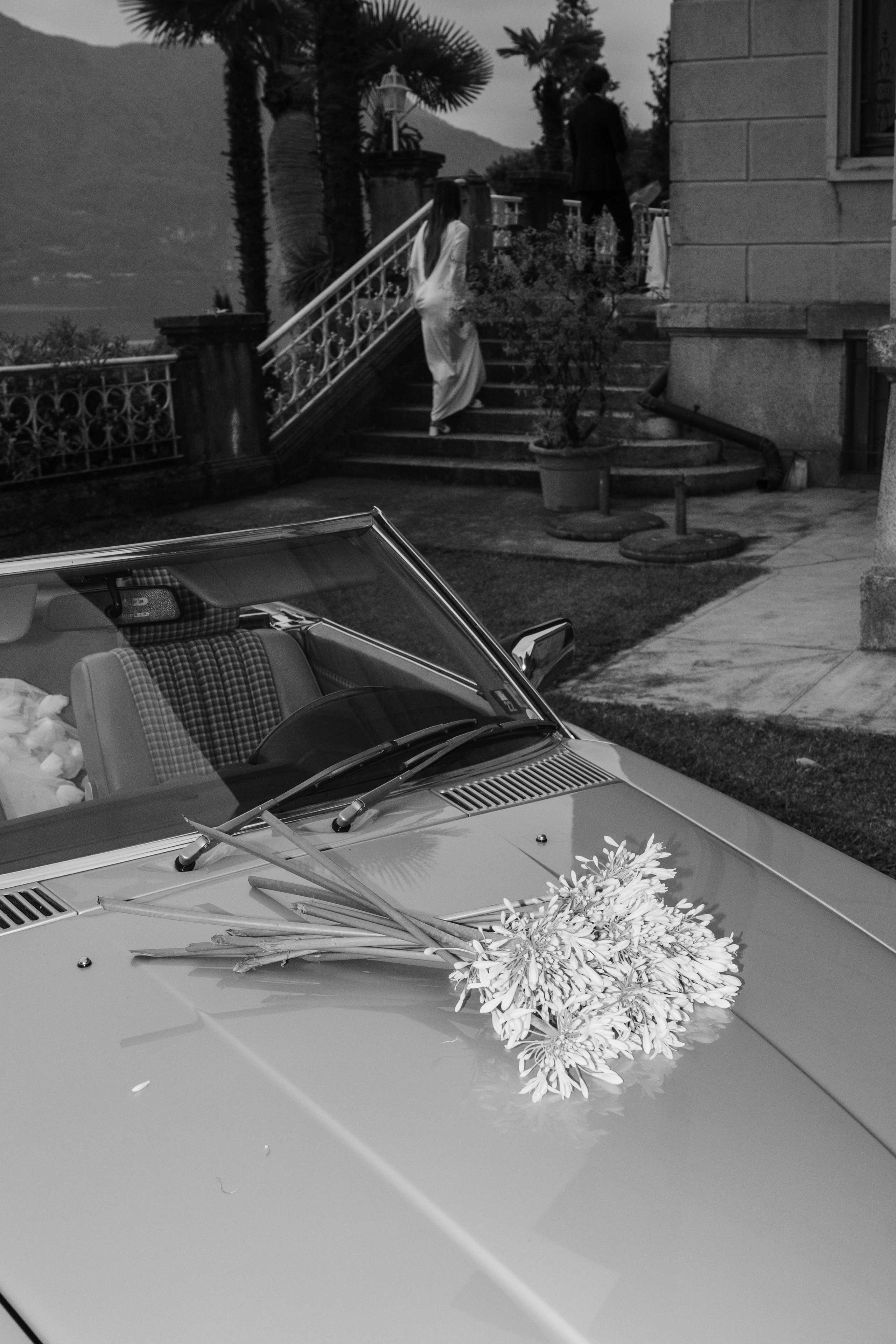 a car with a bunch of flowers on the roof