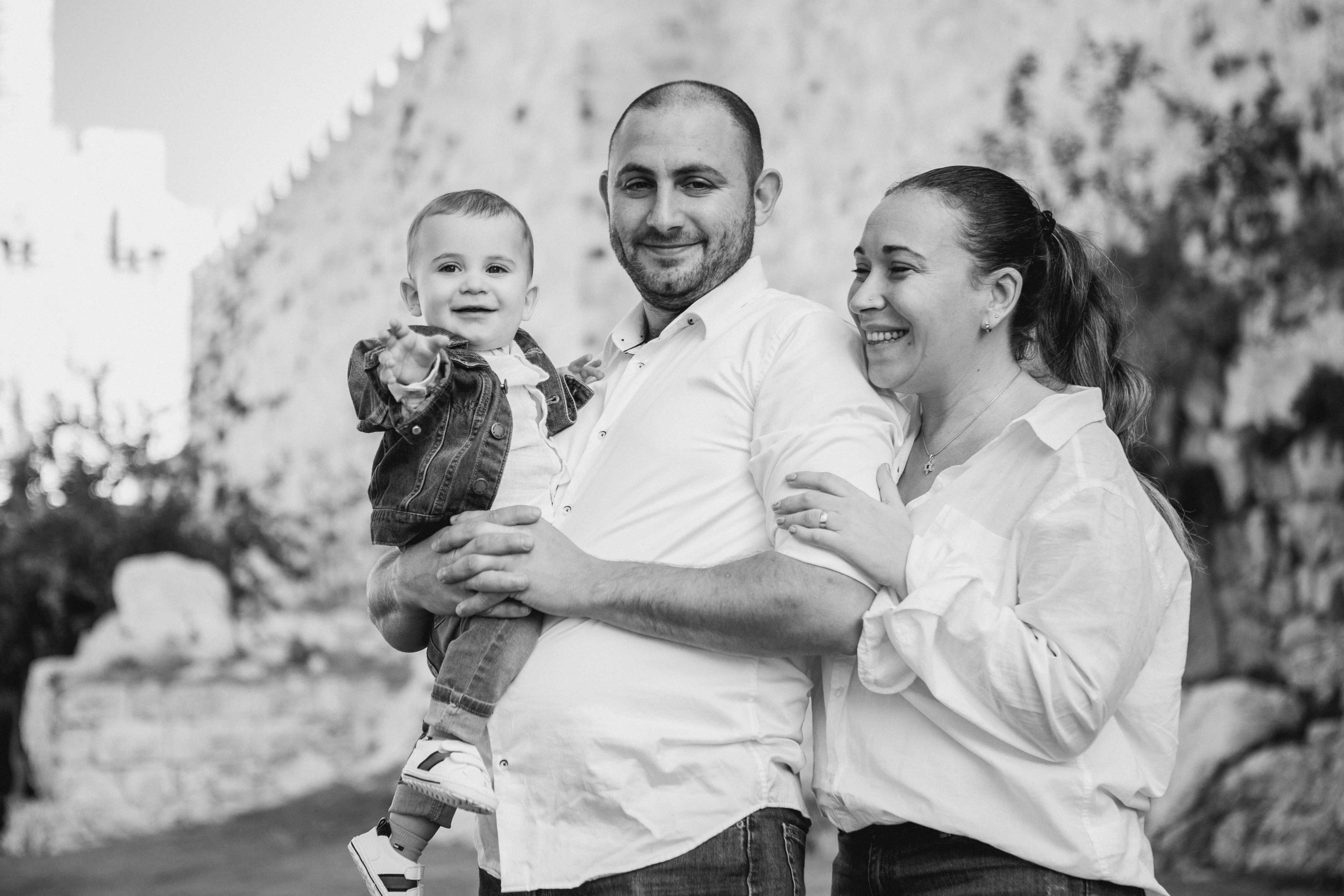 AT THE WALLS OF THE OLD CITY. PHOTOGRAPHER IN ISRAEL