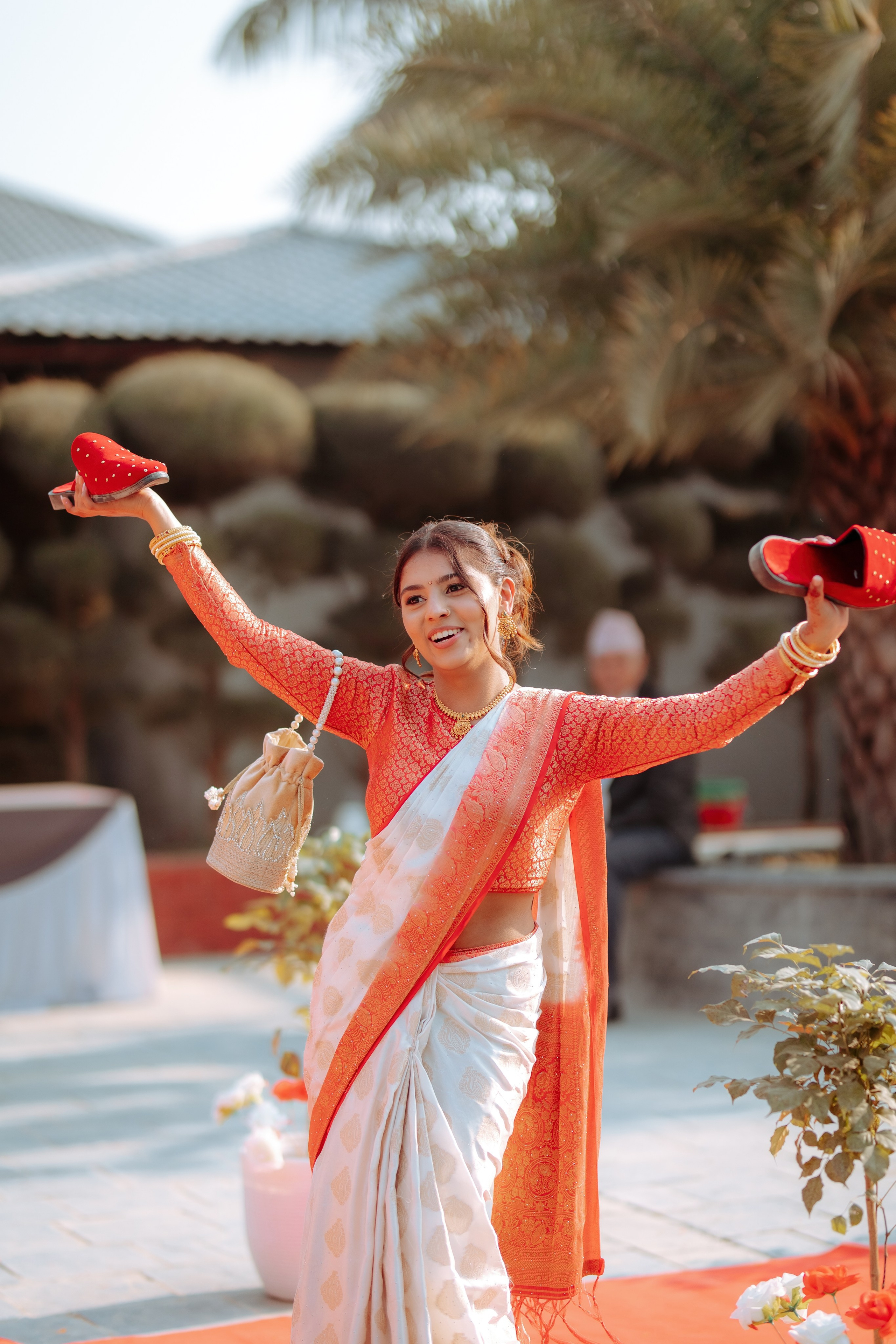 Excited sali showing stolen wedding shoes during traditional marriage rituals creative wedding moments Nepal