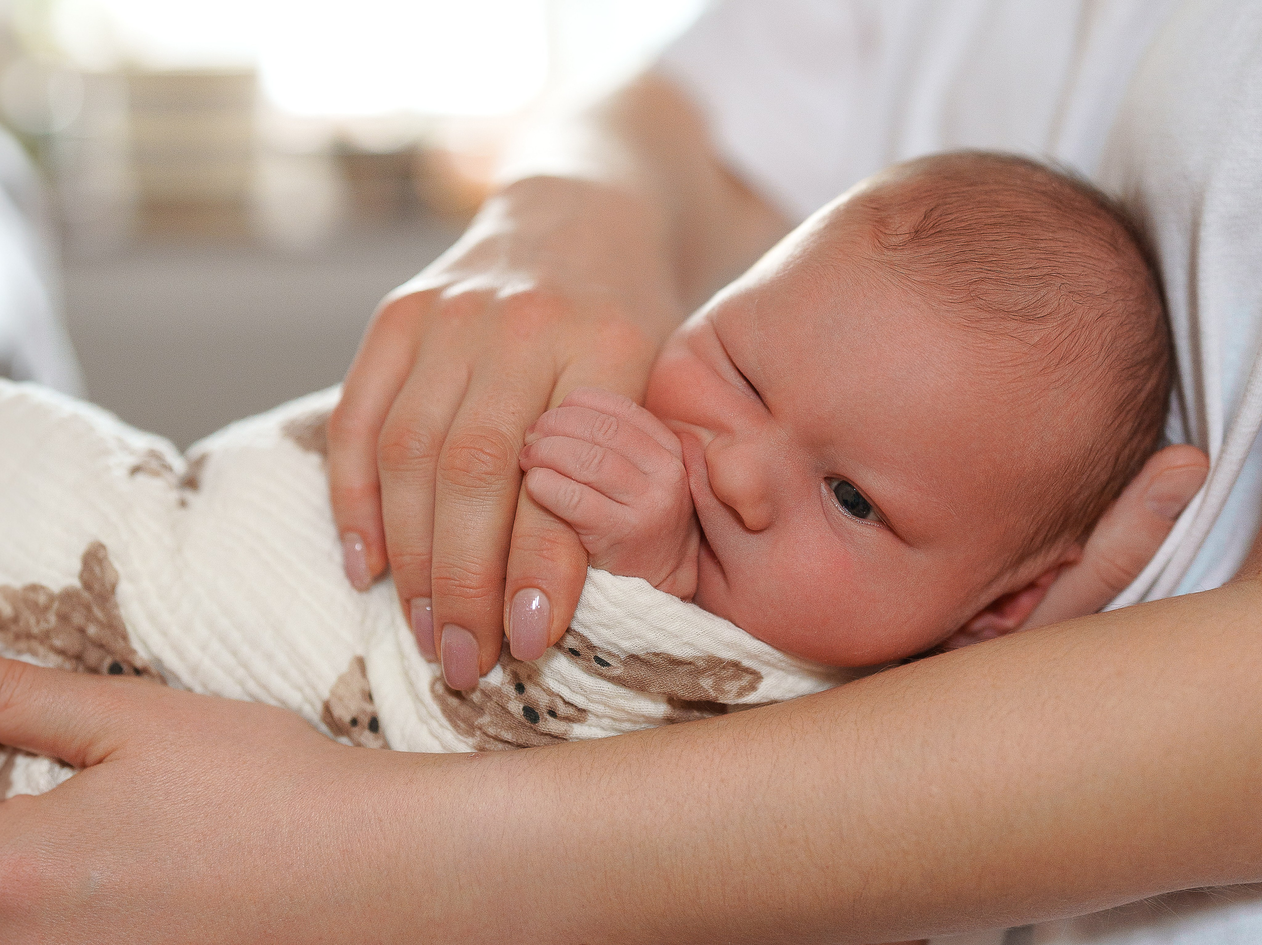 Baby girl home shooting. Family, conceptual women portrait photograher in Geneva, Switzerland