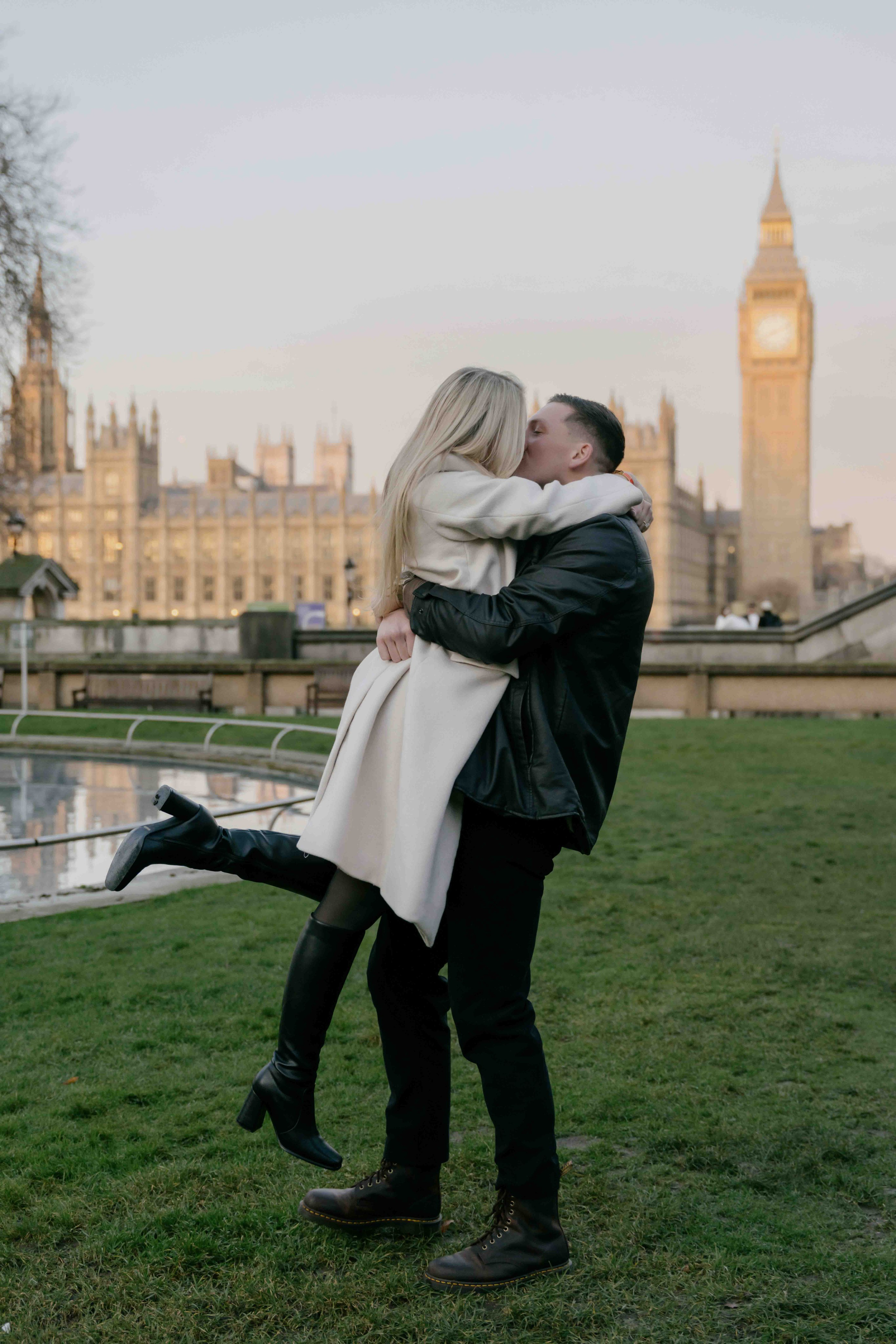 Couple hugging near Big Ben after proposal London engagement photos