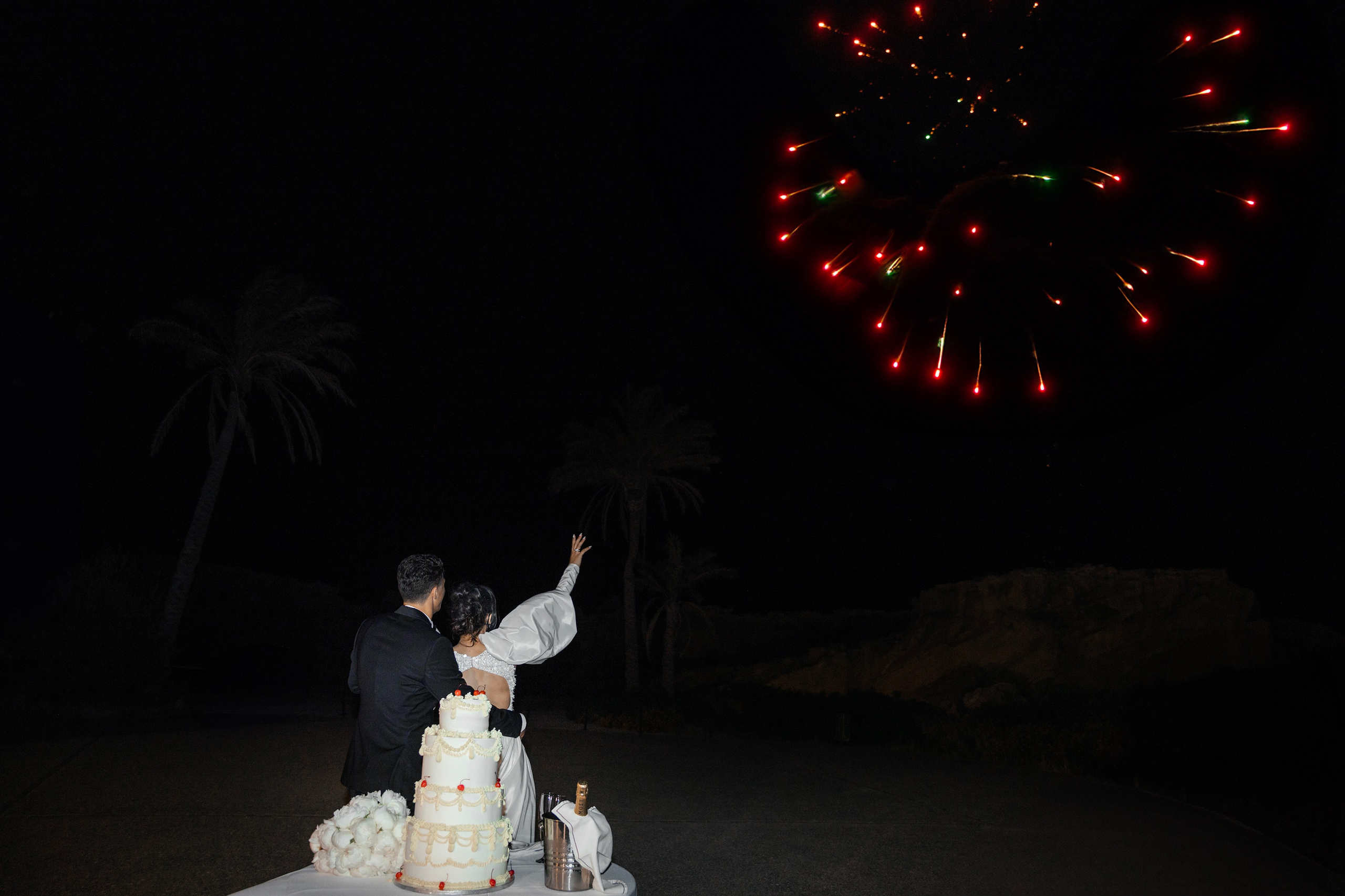Bride and groom are watching the firework. Rhodes Greece