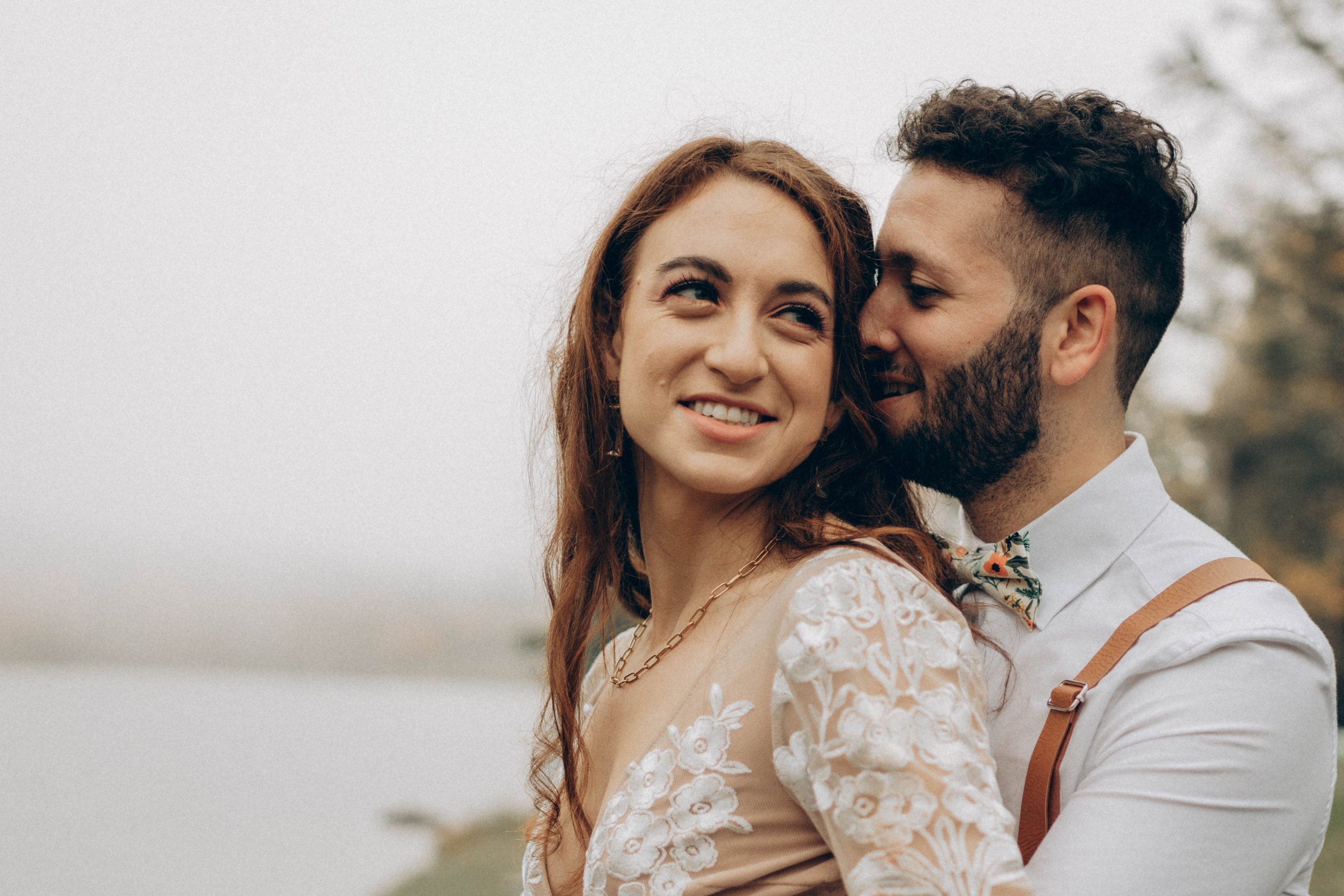 Soft natural light bridal portrait in elegant lace gown, photographed by Upstate New York wedding photographer