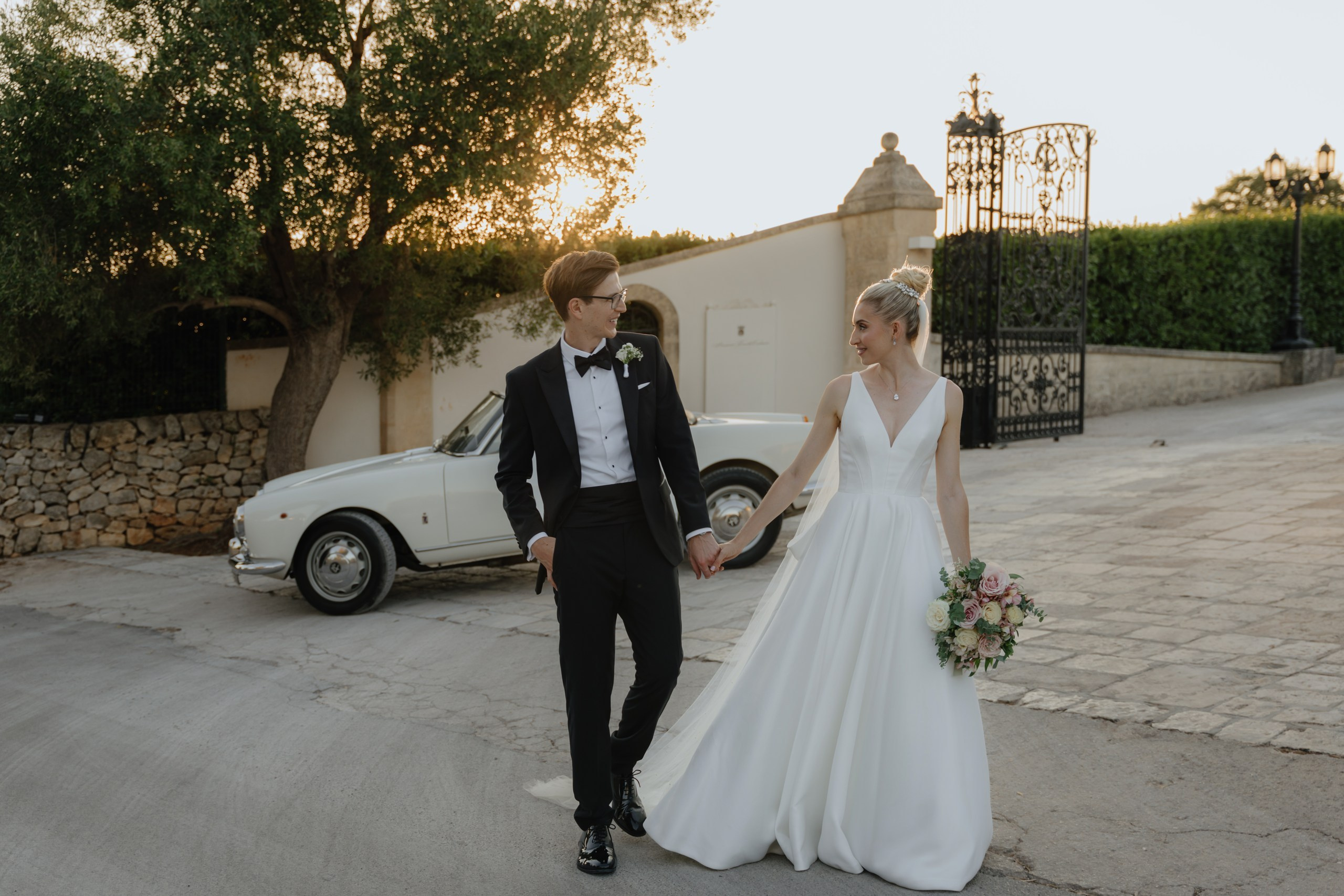 Natural candid wedding couple photo in courtyard of Masseria Traetta